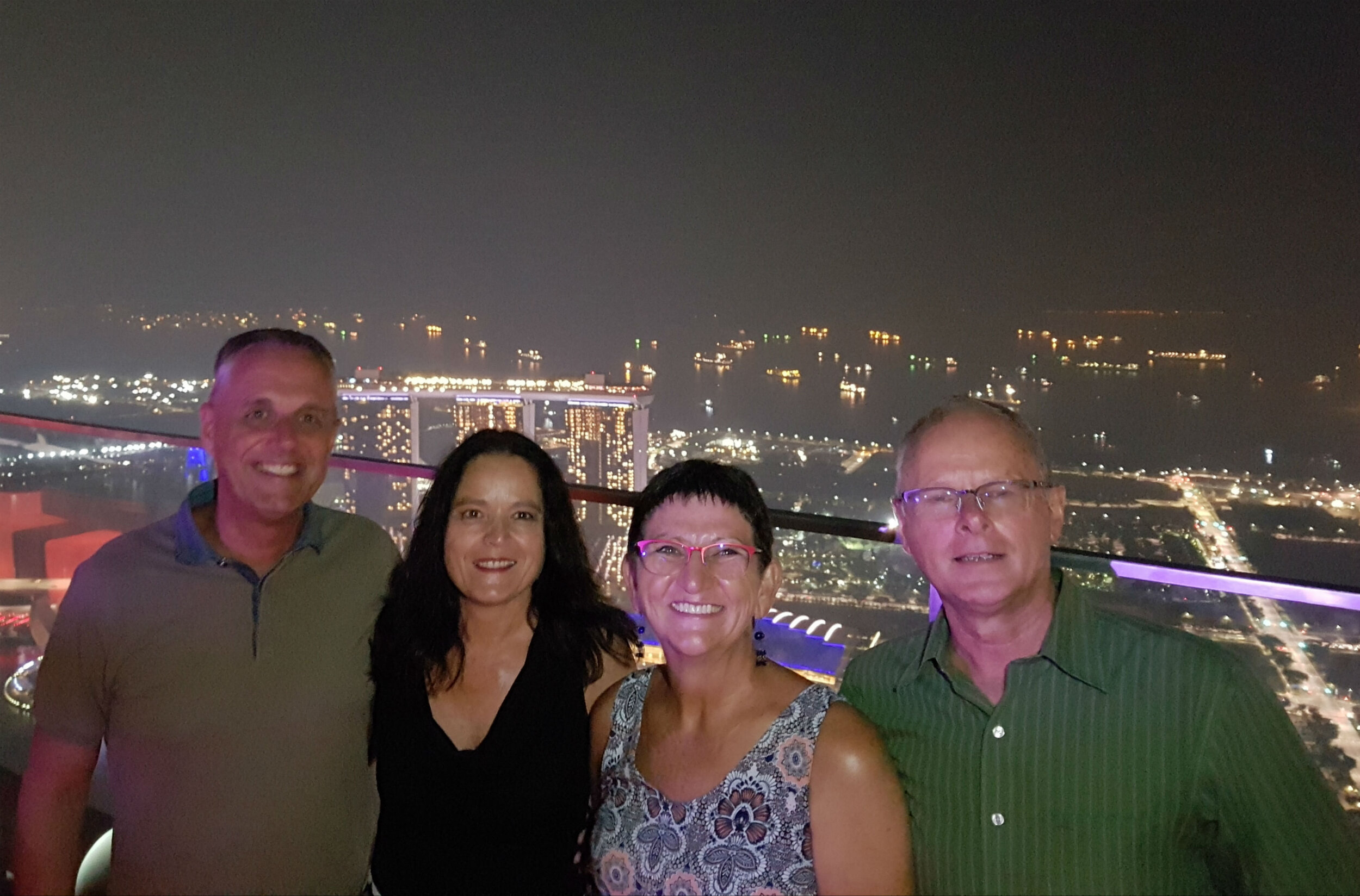 Jo, Roberta, Francien and Frank on roof top bar overlooking Singapore skyline