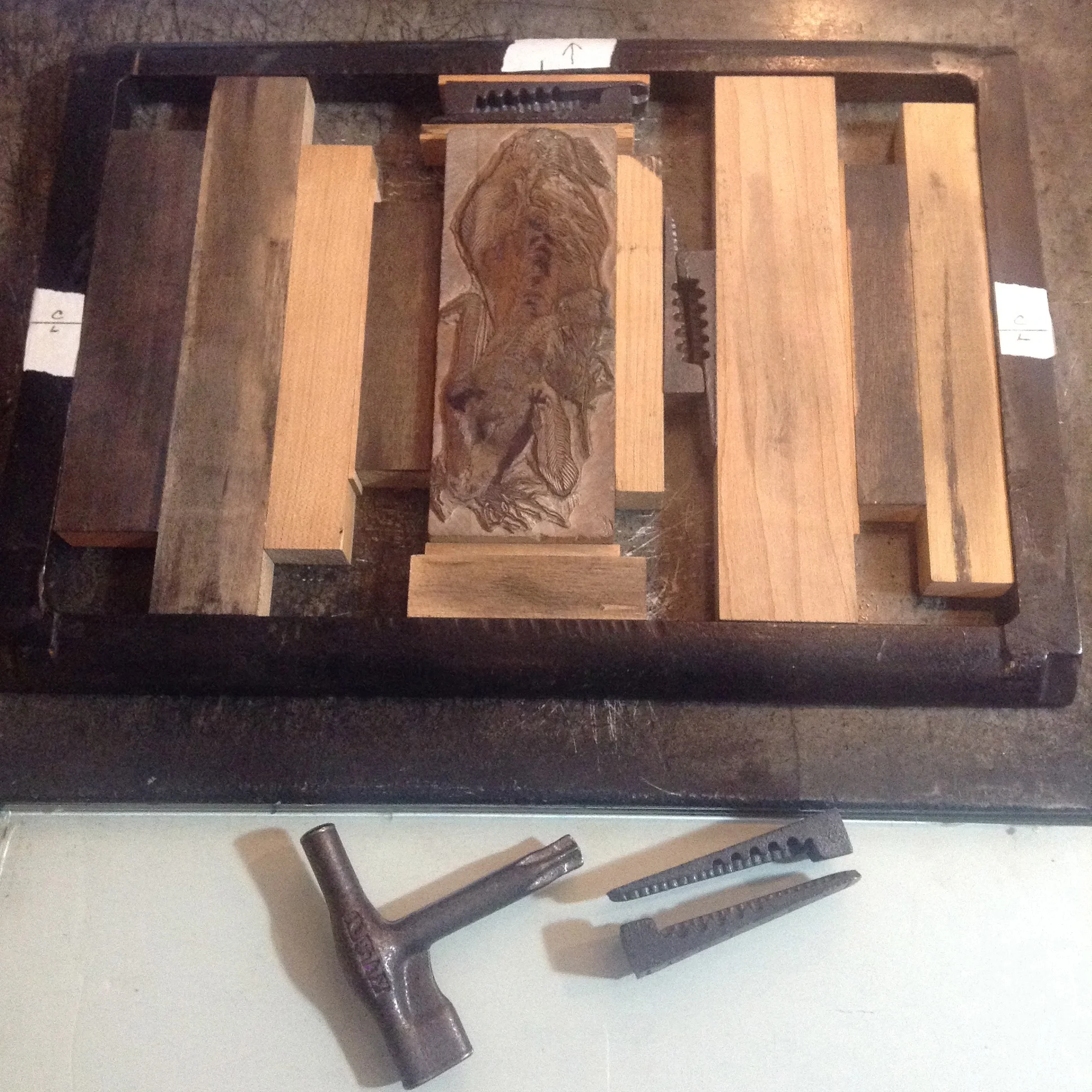 Finished block is put into the chase, blocks of wood and quoins lock it in place