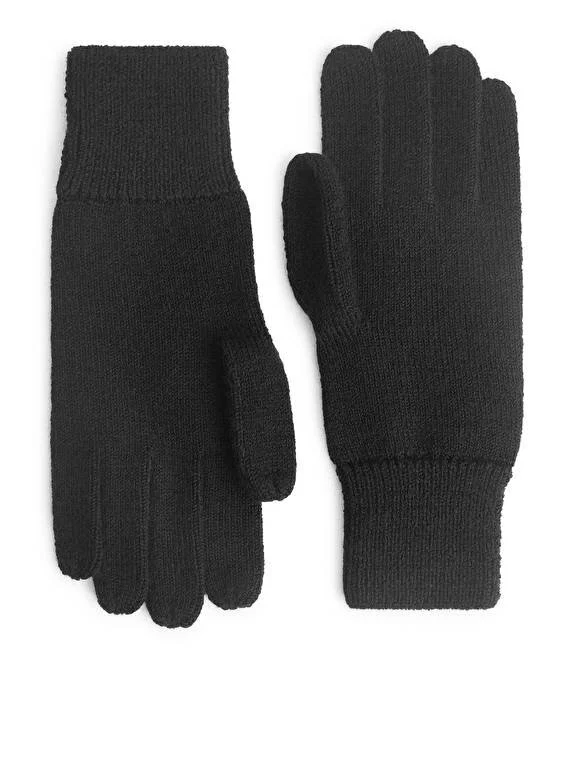 Knitted gloves which are made of raw wool for a durable and warming comfort.