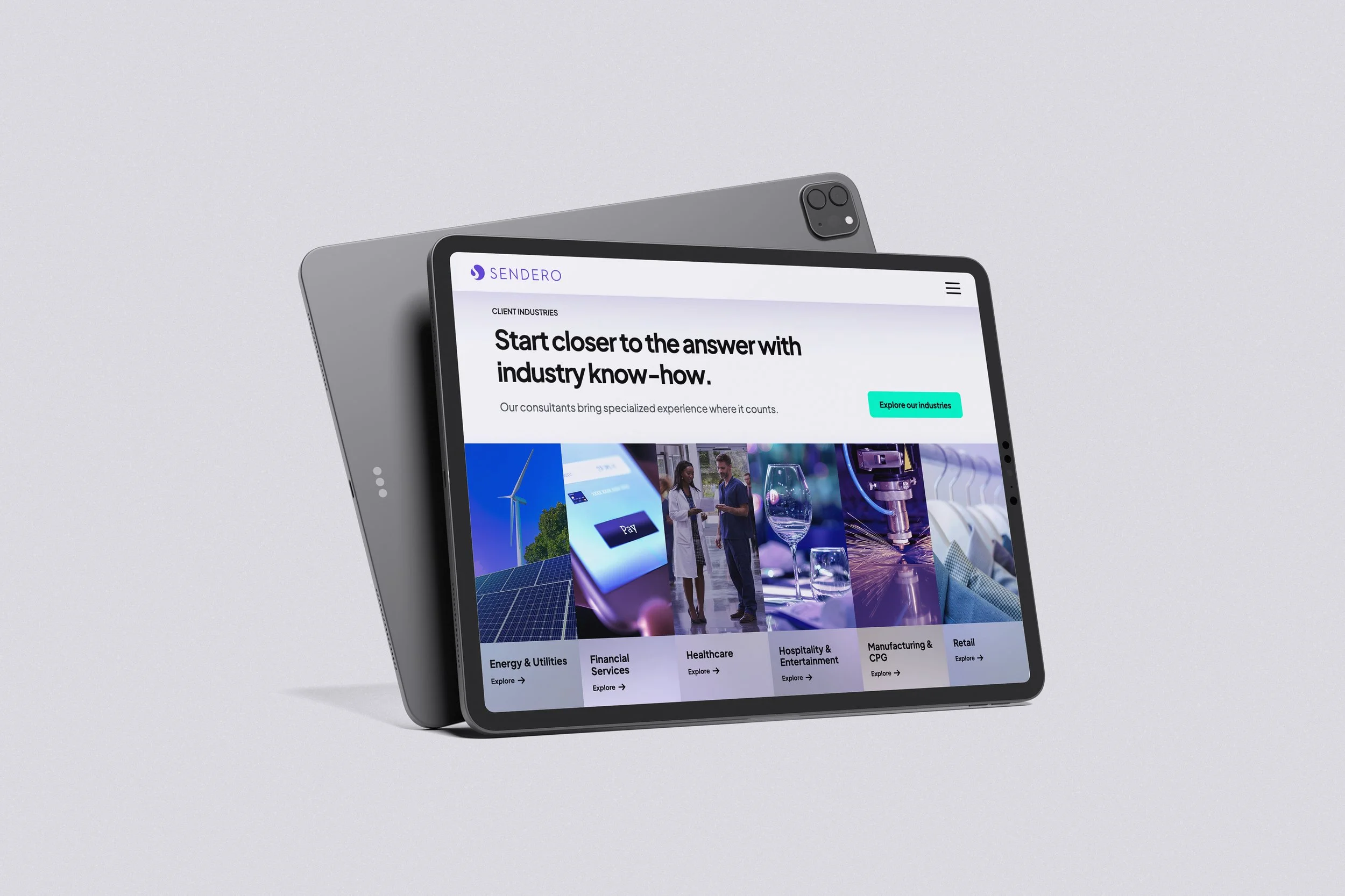 A tablet displaying a website with the header 'Start closer to the answer with industry know-how,' with images of people in discussion, solar panels, a wind turbine, and scientific equipment.