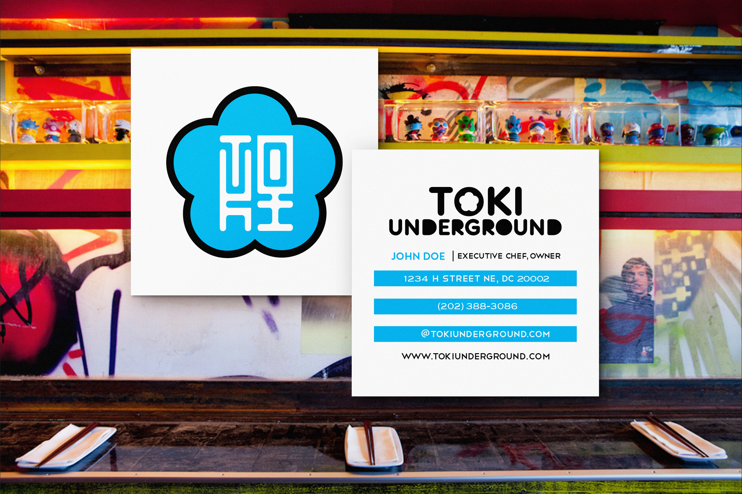 Business card for Toki Underground featuring a blue cloud logo, contact information, and a background of graffiti art.