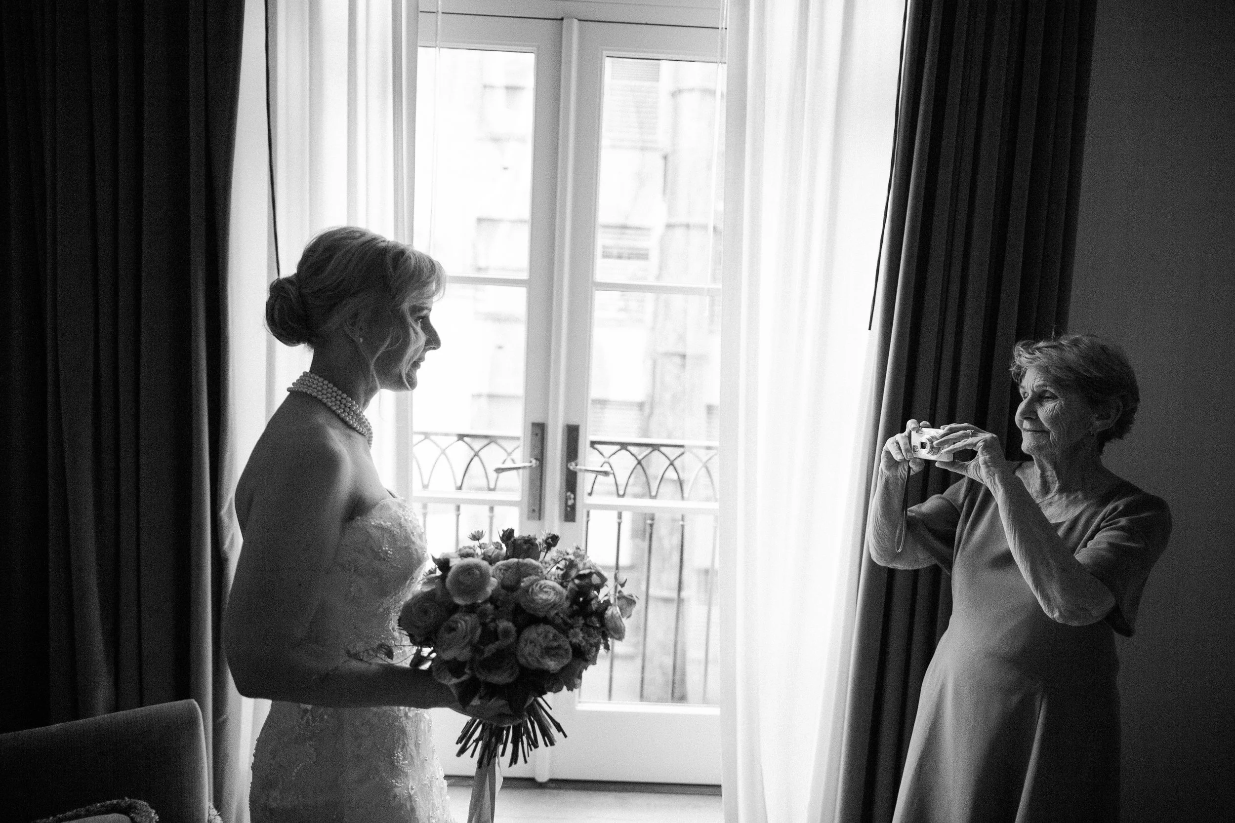 Suzanne's mother takes a moment to capture her daughter, ready to be married.