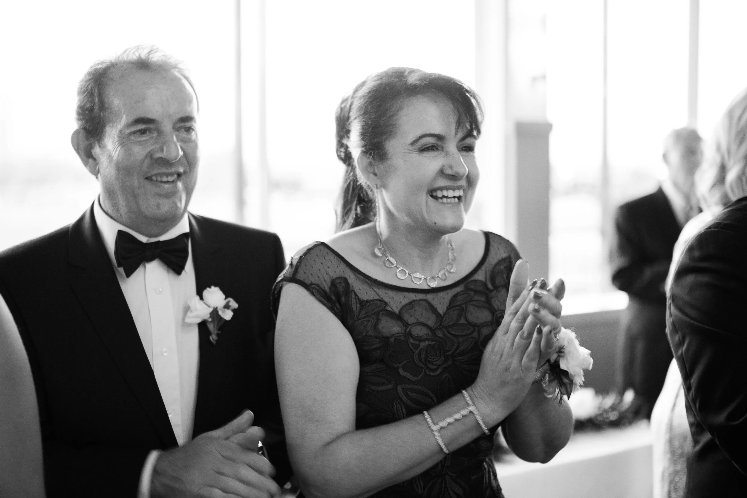 Oscar's mom looks on during his first dance with her new daughter-in-law.