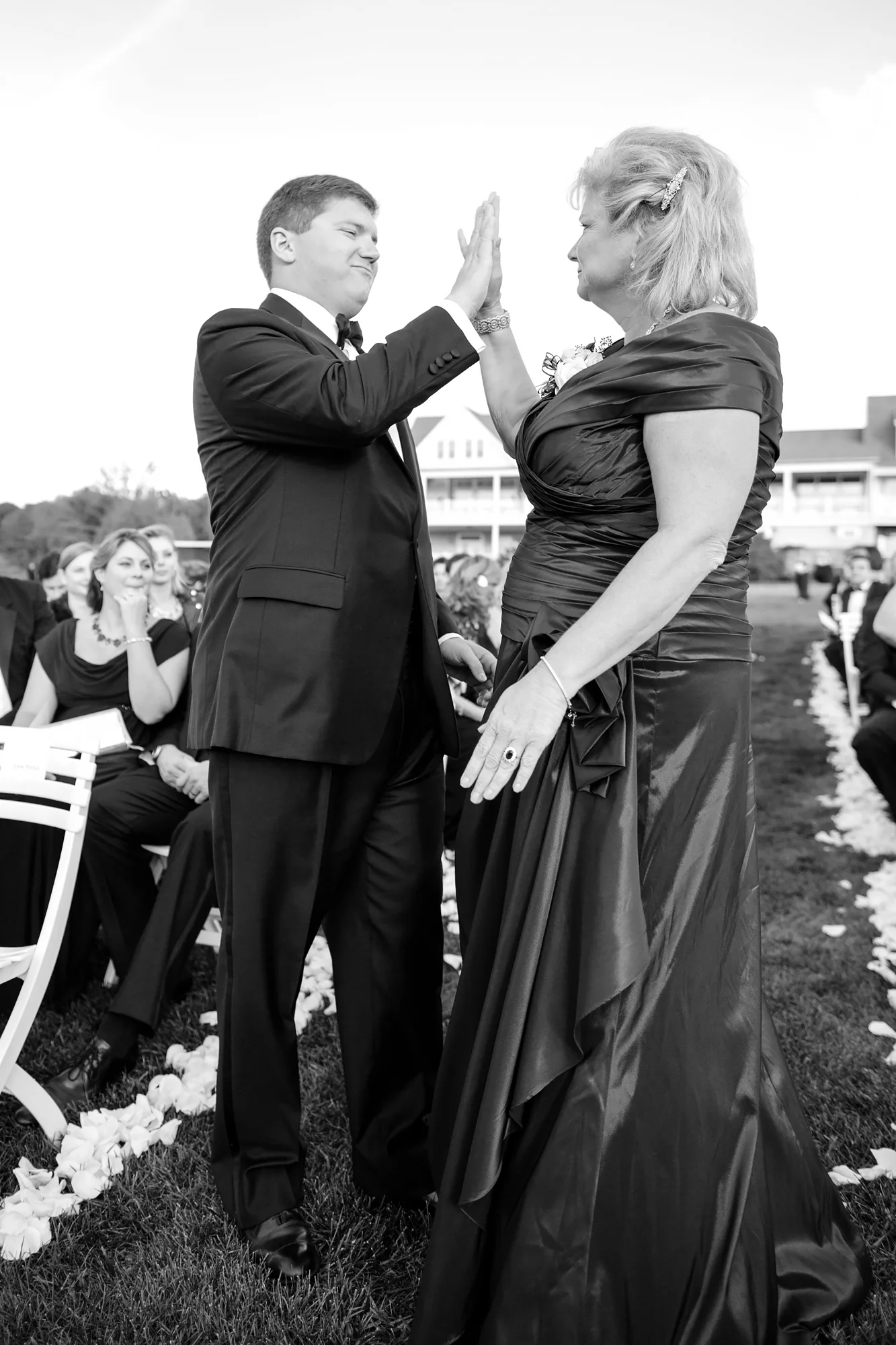 Dan gives is mother a high five after he walks him down the aisle.