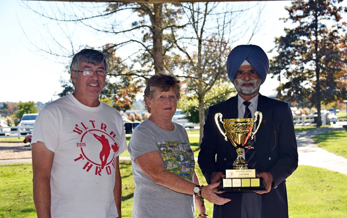 Last year’s recipient, Rose Hare presents Harnek Toor with the Challenge Trophy. Left is Club president, Dave McDonald. (Photo: Owen Wong)
