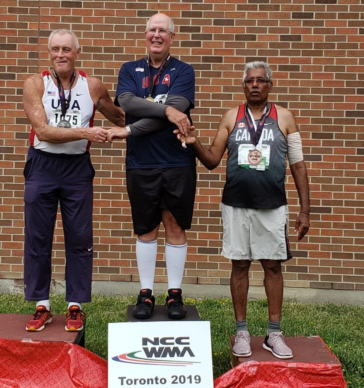 Ultra Throw’s Mohan Bains seen far left in Toronto with proud winners of 65-69 age group in the Hammer Throw