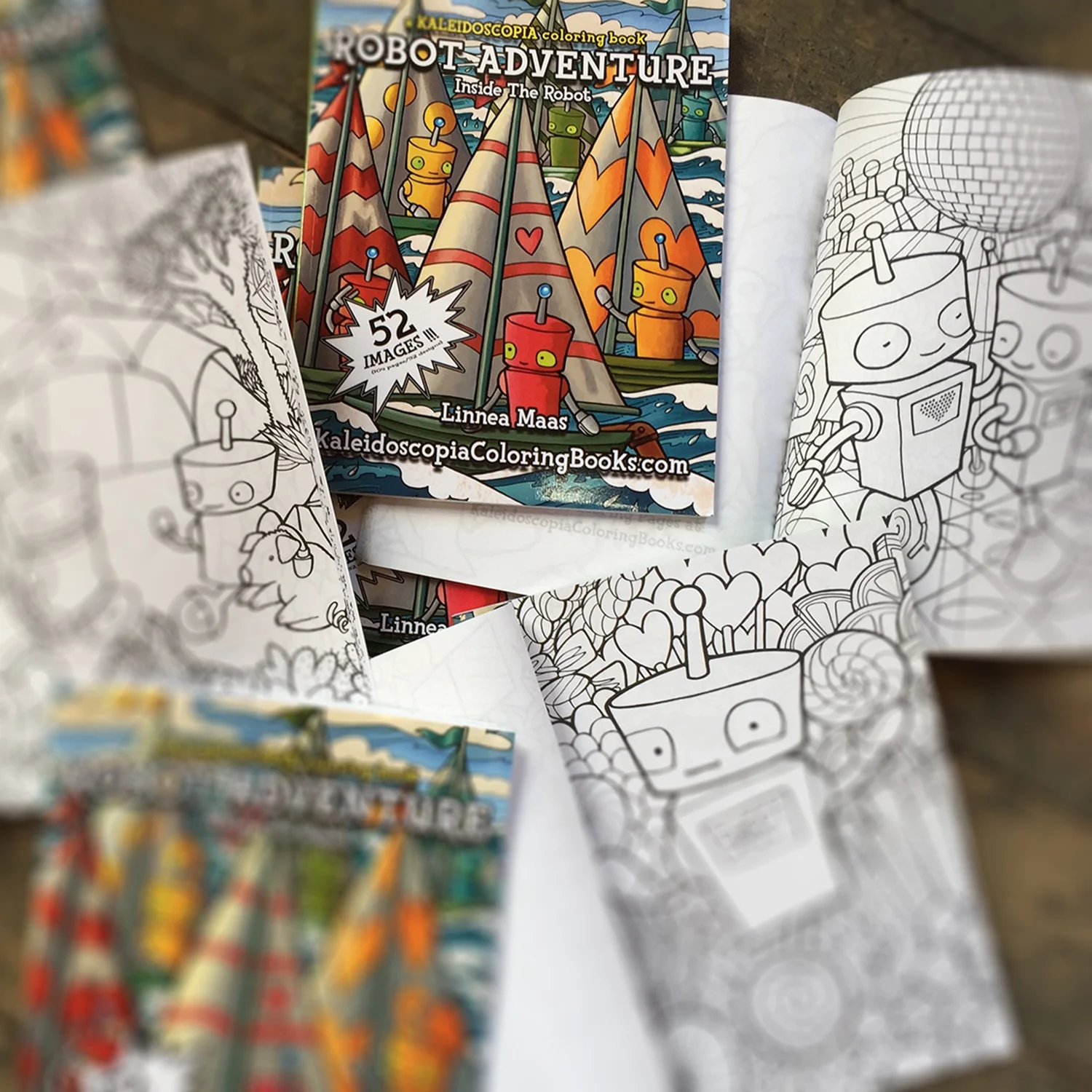 Open coloring books showing pages of Robot Adventure Inside The