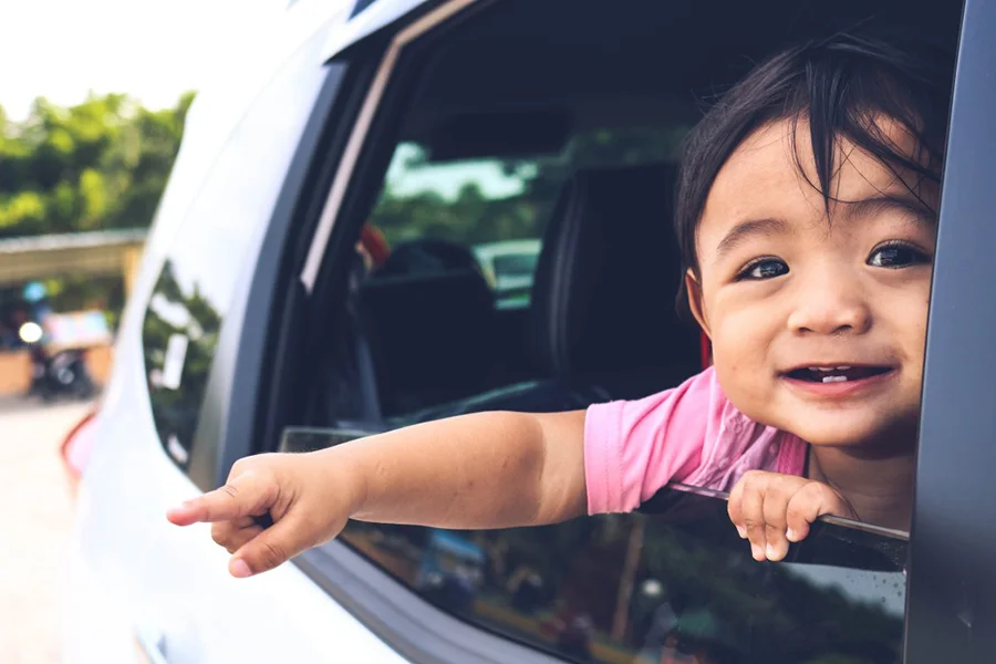 happy little girl in car