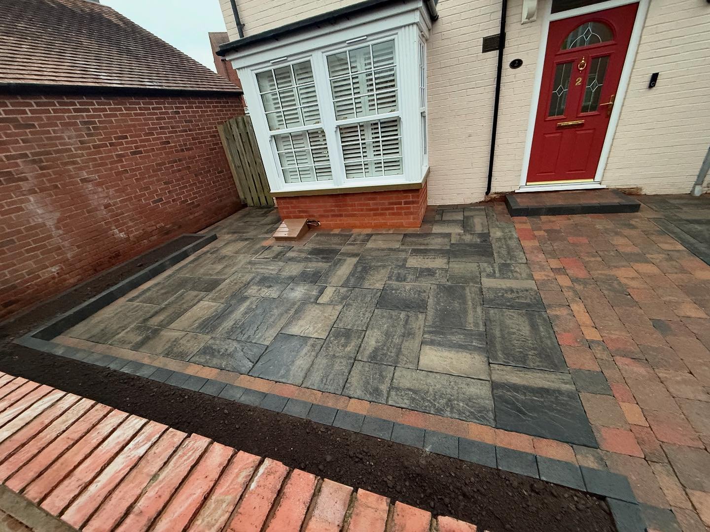 Also completed the slabbing at the front of the house using slate grey tobermore extoric slabs and framing the area using a heather tumbled cobble effect pavor. We also provided raised beds using a tumbled kerb to retain the top soil. Get in touch to
