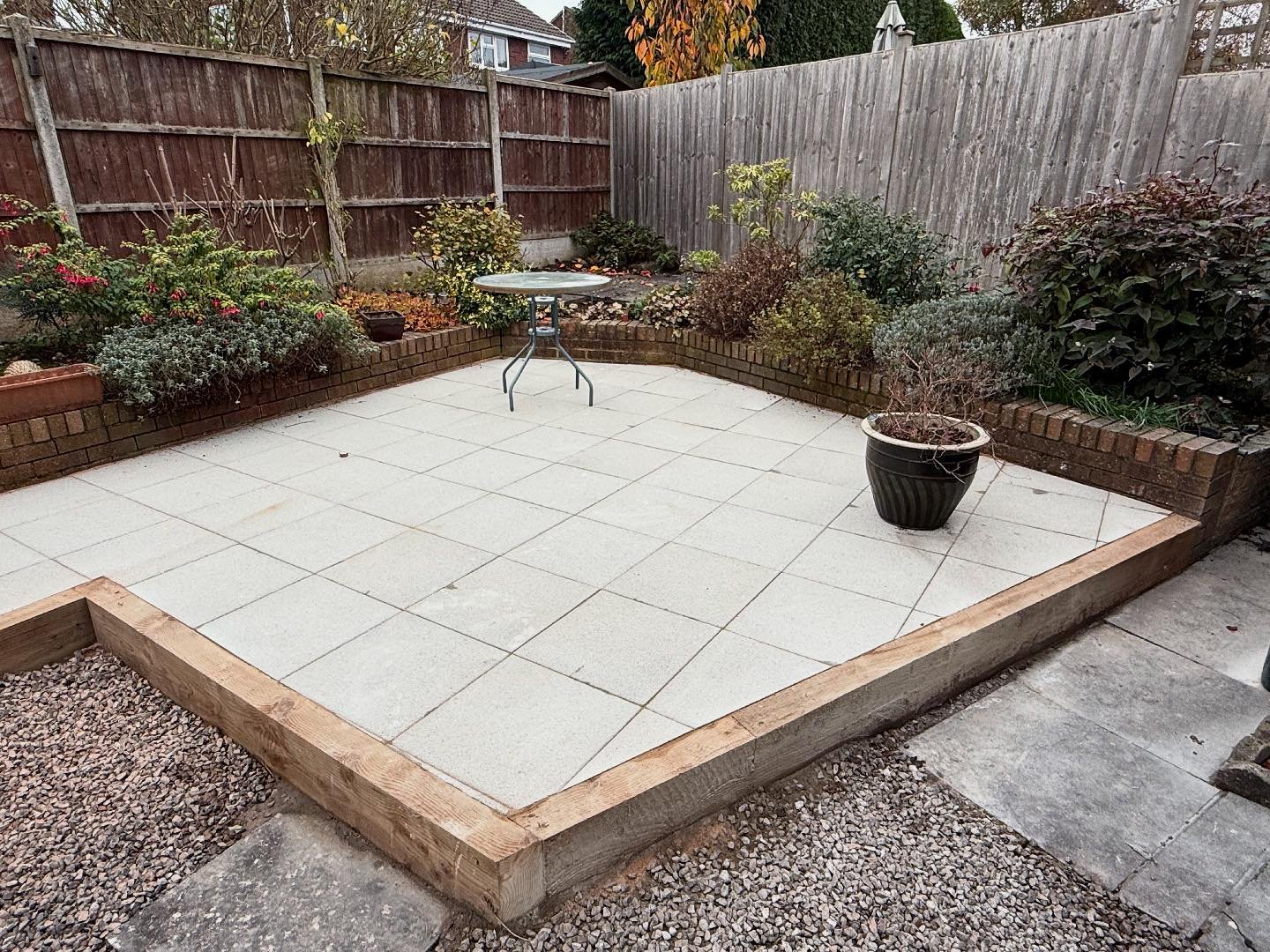 Another lovely patio completed here today at DriveCo✅ using a 18inch square textured light grey tobermore slab and using a tantalised treated sleeper to retain the patio turning the project into a raised seating area. Get in touch today for your free
