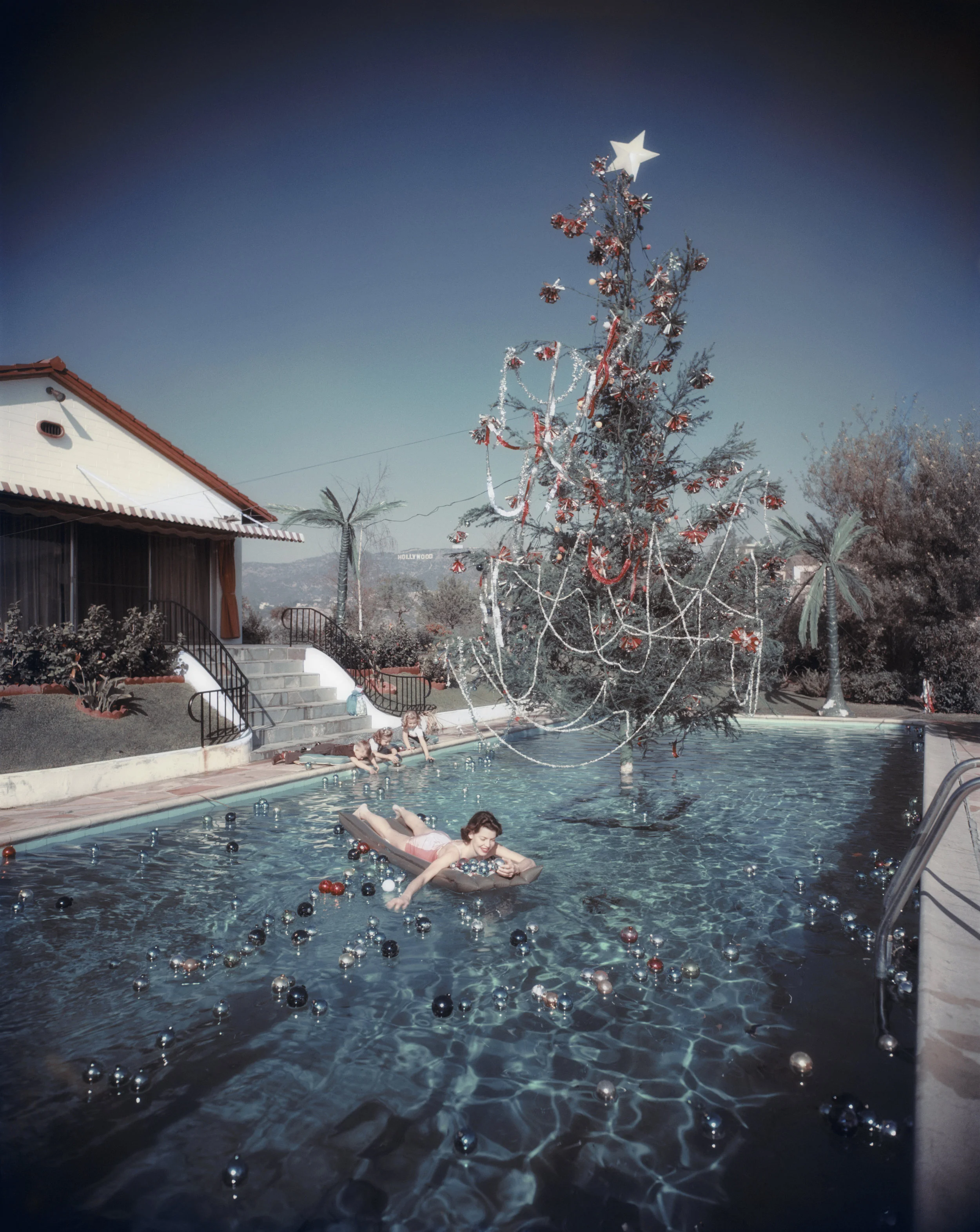 SLIM AARONS, Christmas Swim , 1954, courtesy Getty Image Archive