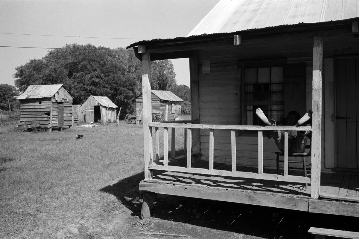 CONSTANTINE MANOS, Untitled, Island Boy, Daufuskie Island, South Carolina (boy on porch), 1952