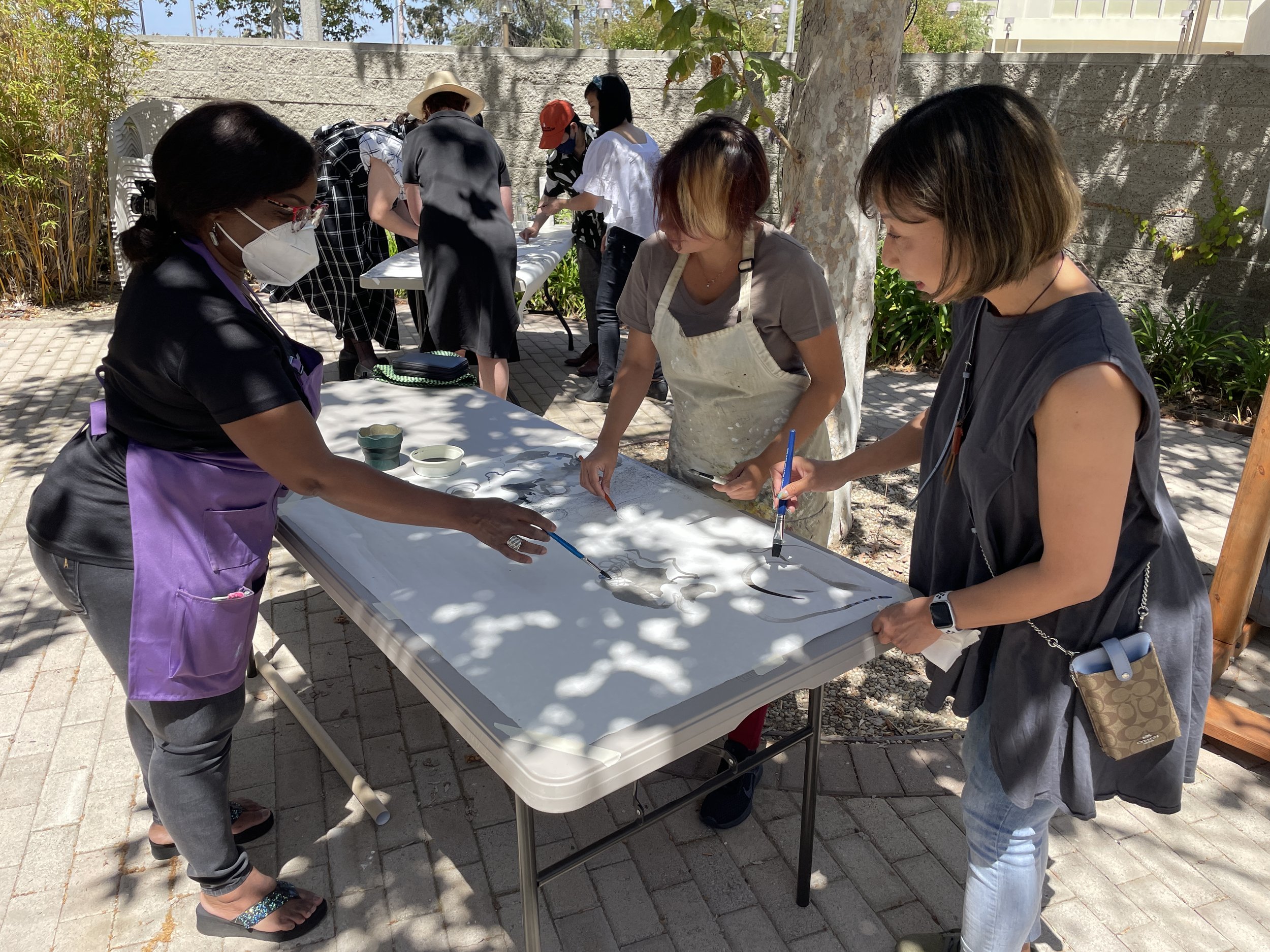 Collaborative drawing workshop at Torrance Art Museum inspired by tree shadows