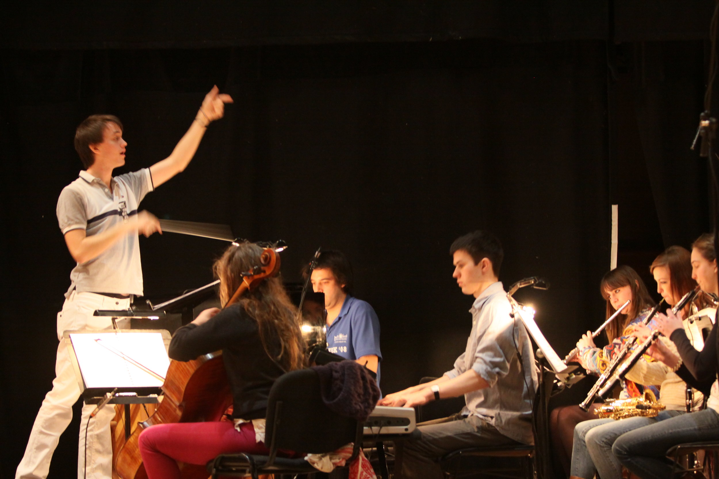 Jude conducting The Forbidden Fruit orchestra, Brighton Festival, Brighton Dome, composed by Jude Obermüller (photo by Sarah Sutherland-Rowe)