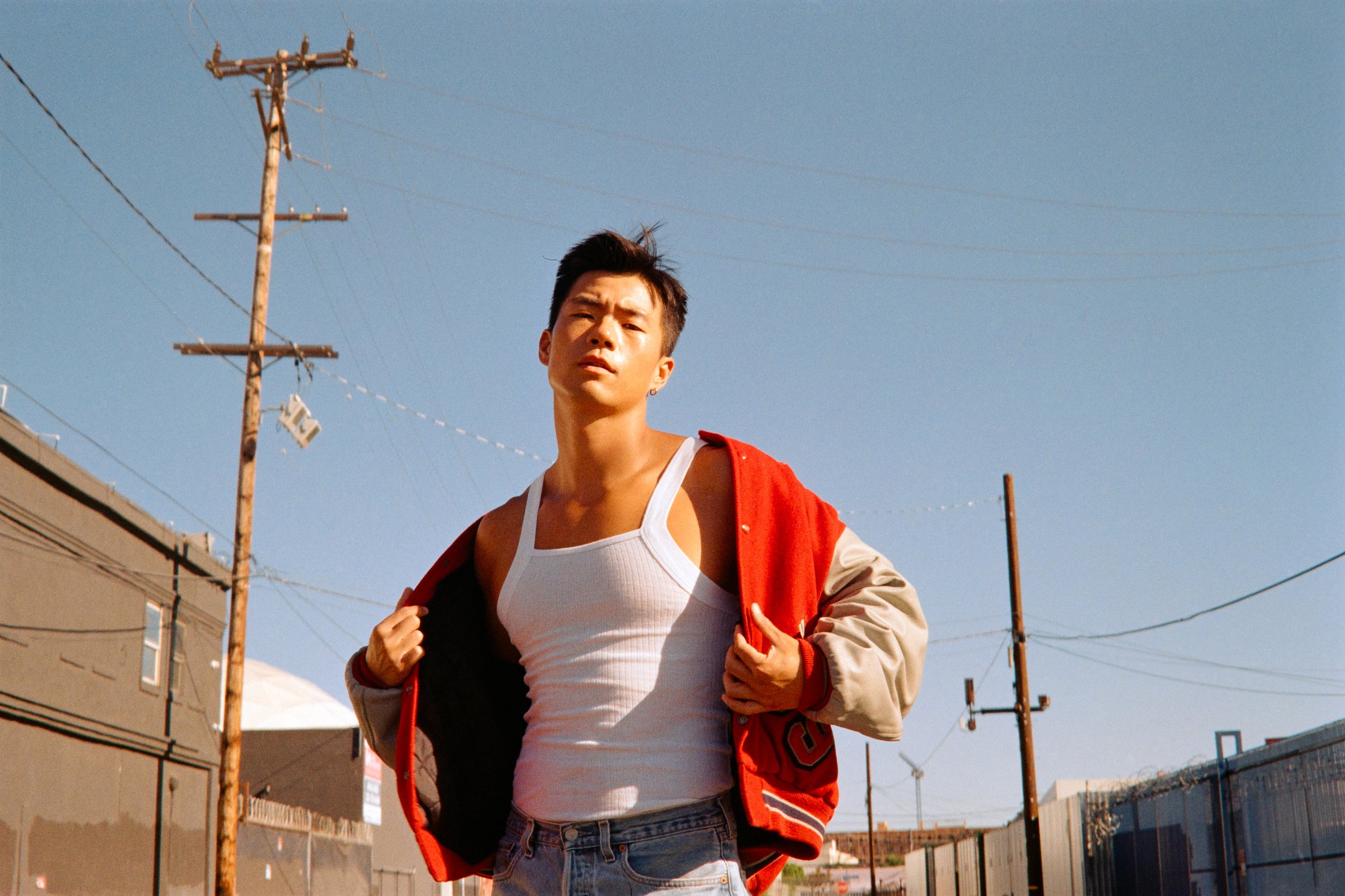 Portrait of actor Ty Chen wearing letterman jacket