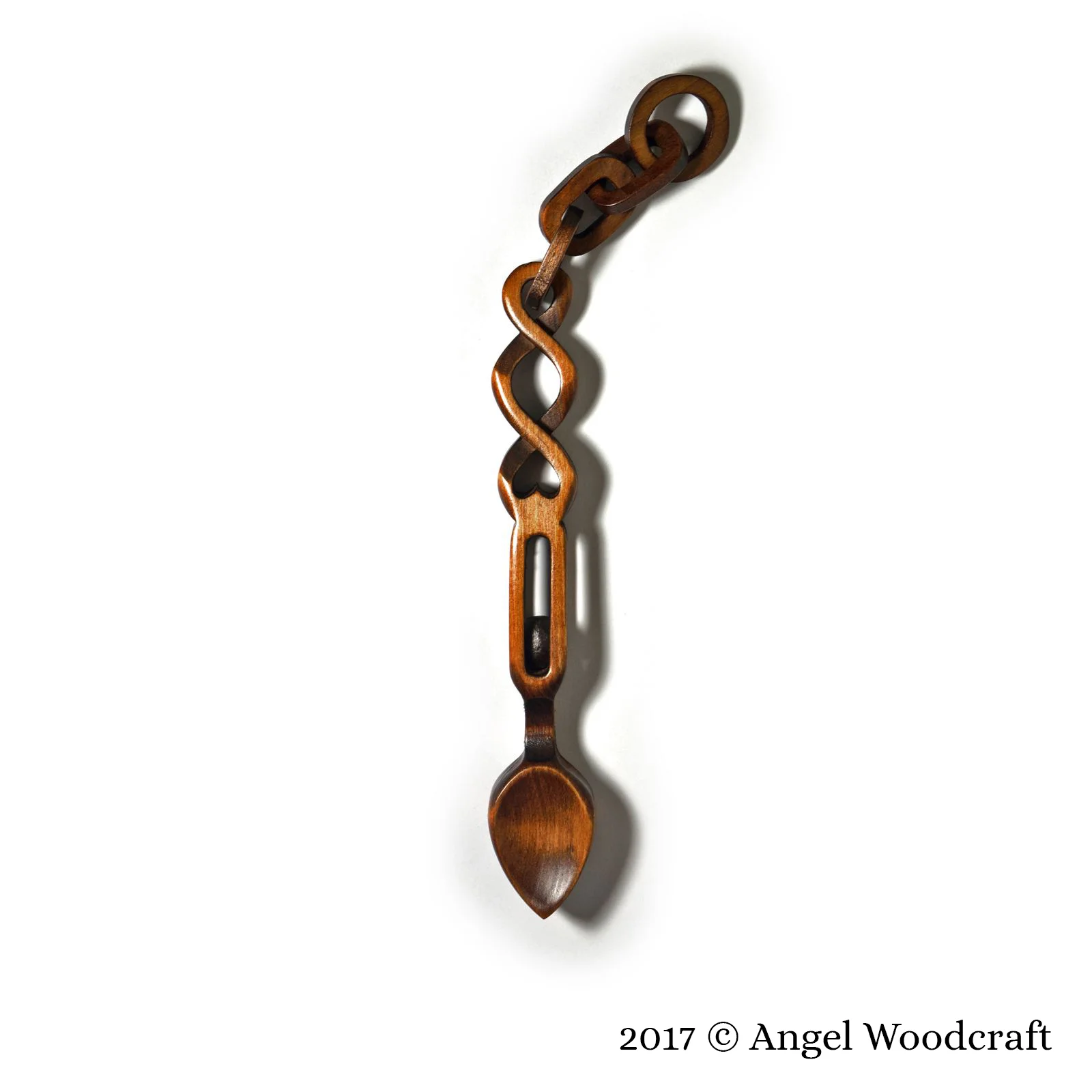welsh love spoon balls in cage and chain links 2