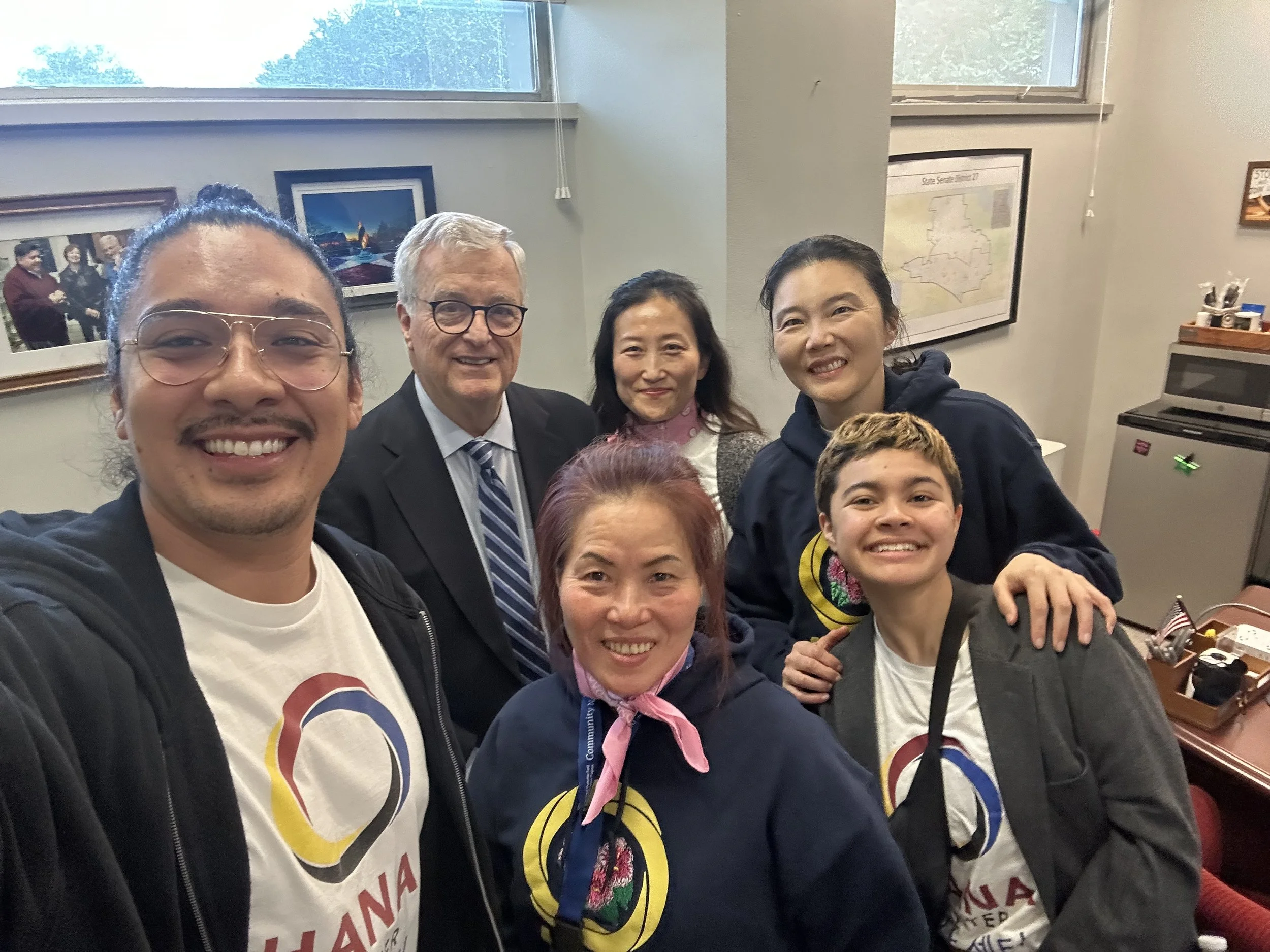  Community Navigator Yonhui Castillo (center front) with lobby team at AAA Day 