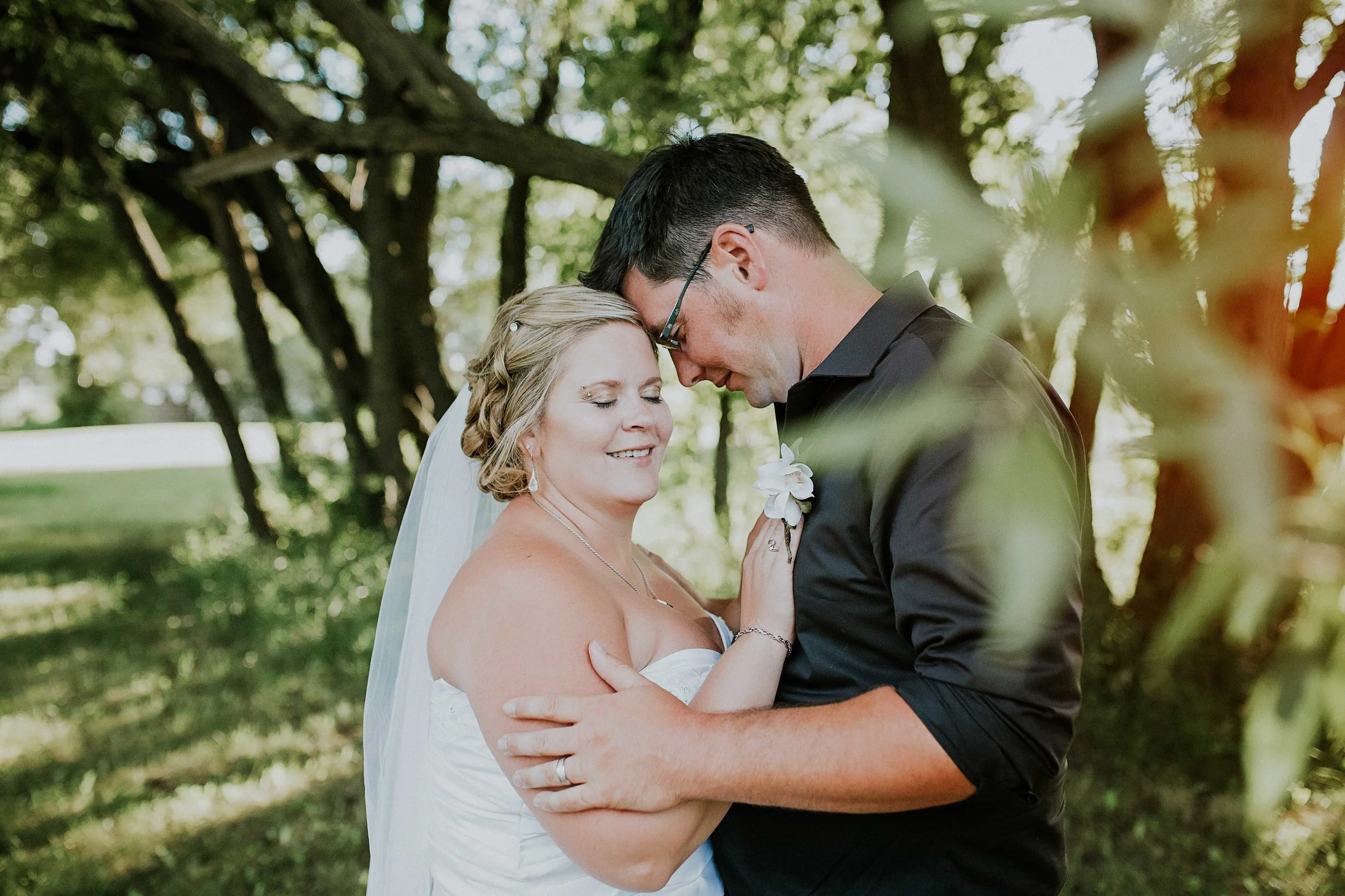 Stacee and Karen have very laid-back personalities, so when it came to their wedding they wanted it to reflect their personalities in a fun, playful, and a rustic way. They had a very intimate, country ceremony on Stacee's grandparents farm. This location was a key spot to making their day special to them. The rustic, chic decor, beautifully captivated the mood and the rustic romance between these two. 