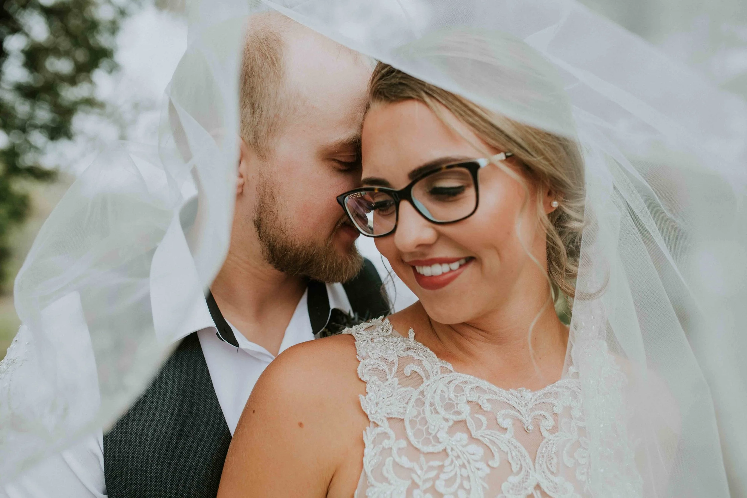 I can't say enough about how much I adore Keegan and Michelle’s backyard wedding! There is so much to love, from all the personalized details to each and every loving, sweet moment. The shades of grey, navy and soft pinks in the floral design brought the atmosphere of a warm Manitoba autumn to life. Lets also stop and enjoy the intricate detail of this stunning gown from Muse Bridal. It has my jaw hitting the floor and mesmerized by its beauty. Take me back to the whispering willows so I can capture this all over again.
