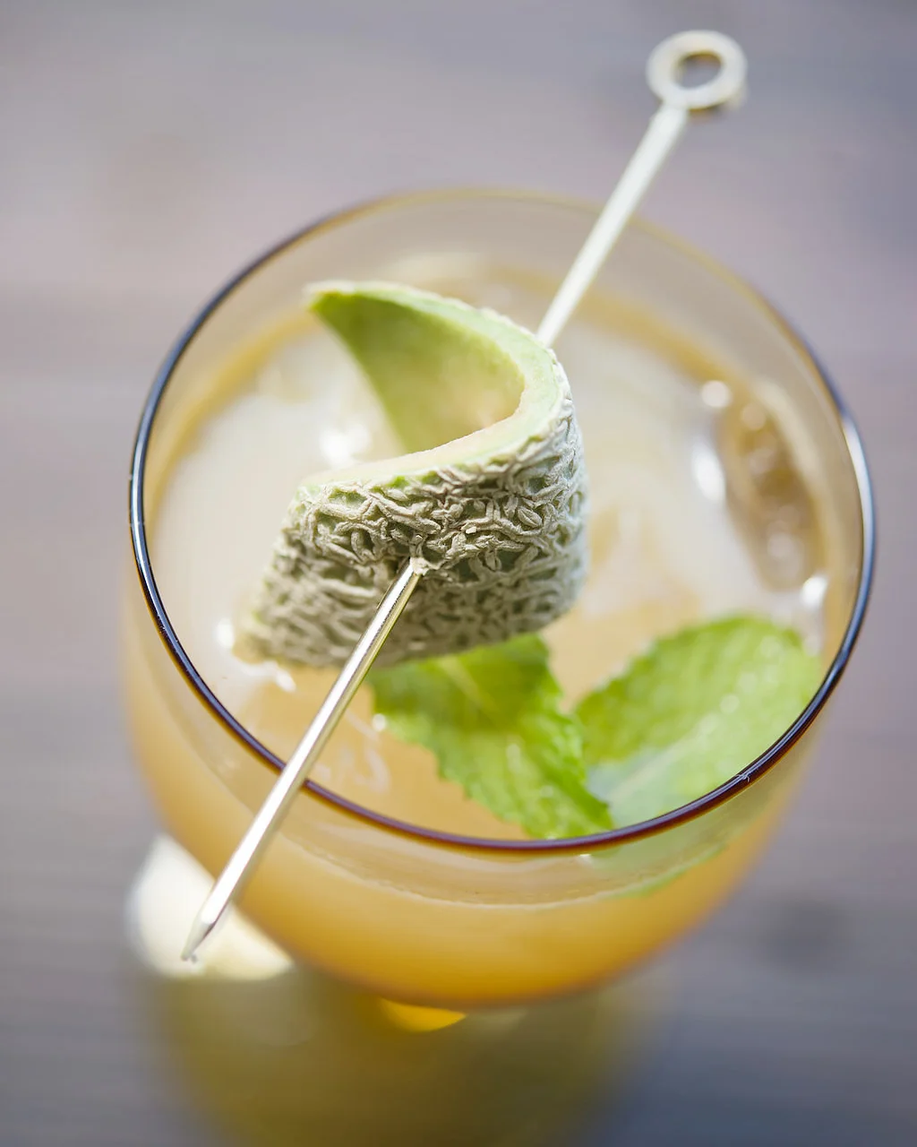 PORCH SWING fresh pressed cantaloupe and lemon, sweet tea, garden mint, cane sugar, bourbon