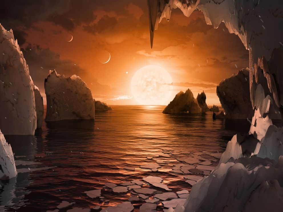  Imagine standing on the surface of the exoplanet TRAPPIST-1f. This artist's concept is one interpretation of what it could look like. 