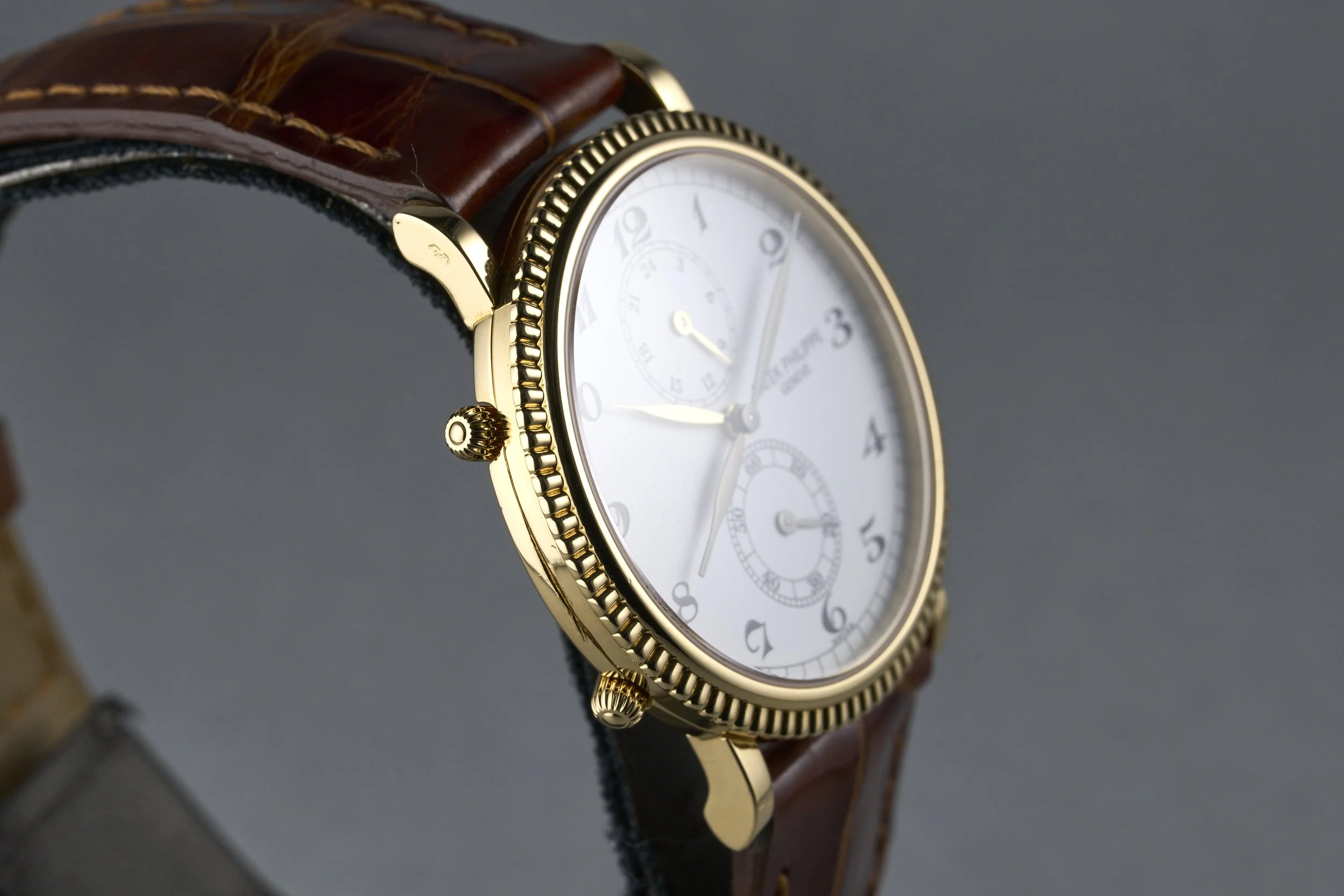 patekphilippe-traveltime.yellowgold.servicepapers-5034-white.roman.dial-2000s-oysterpalace-OP2207-06.jpg