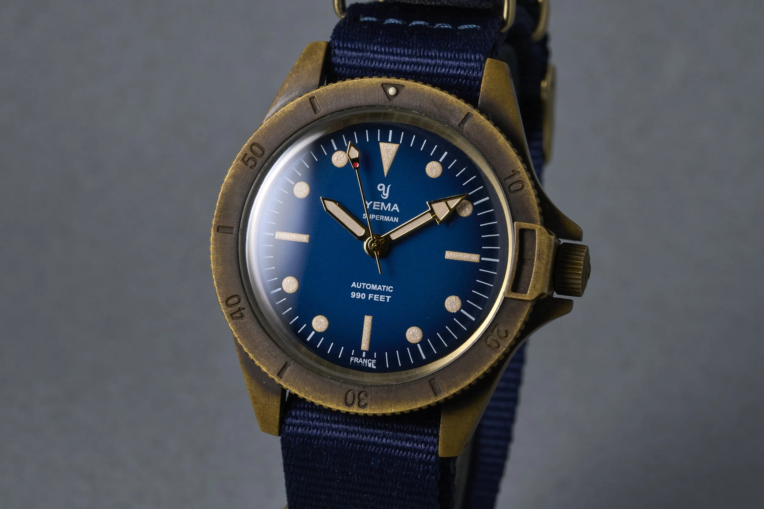 yema-superman.bronze.boxpapers-ysupz-blue.dial-2010-oysterpalace-OP2327-03.jpg