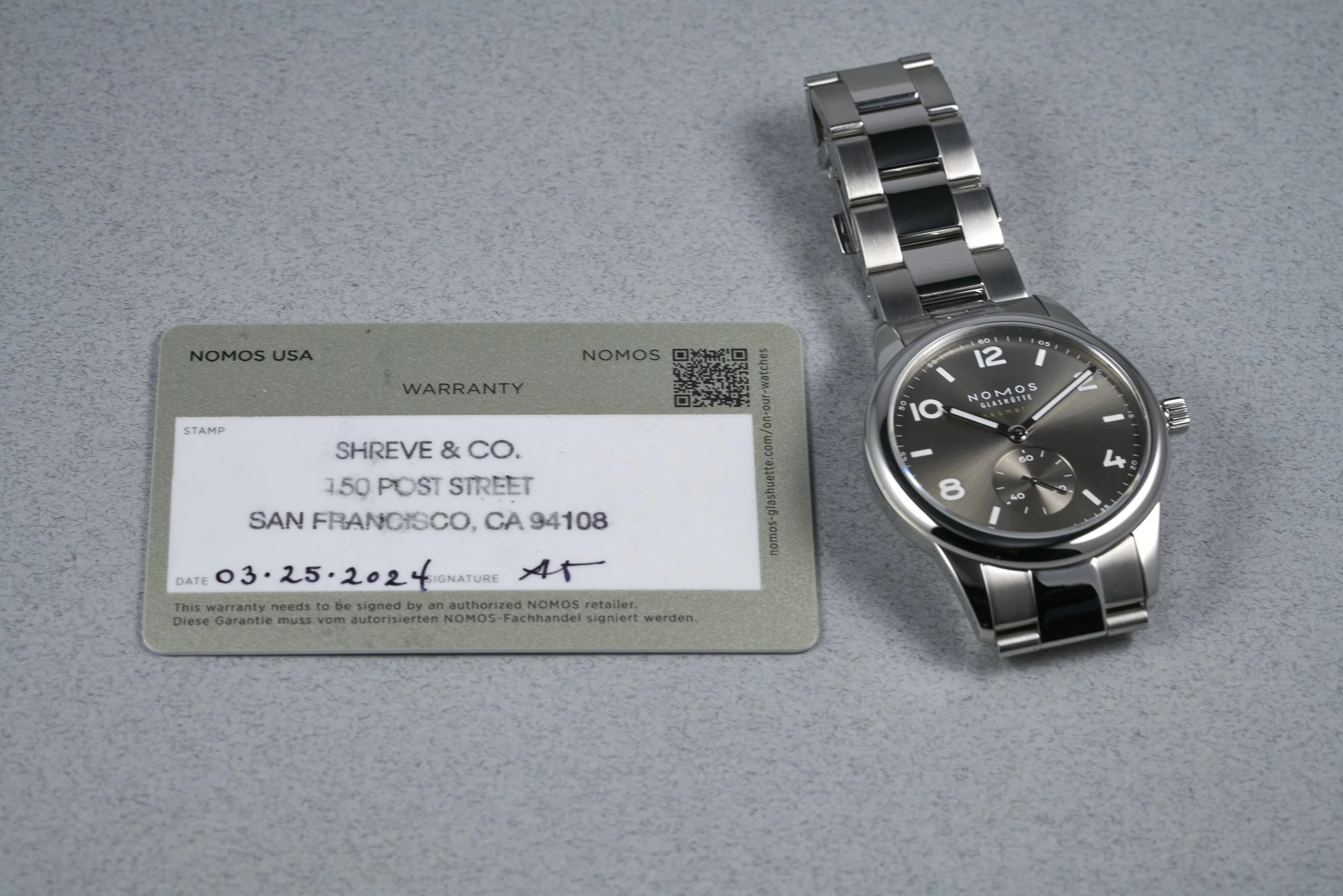 nomos-club.sport.neomatik.boxpapers-764-smoke.dial-2024-oysterpalace-OP2232-12.jpg