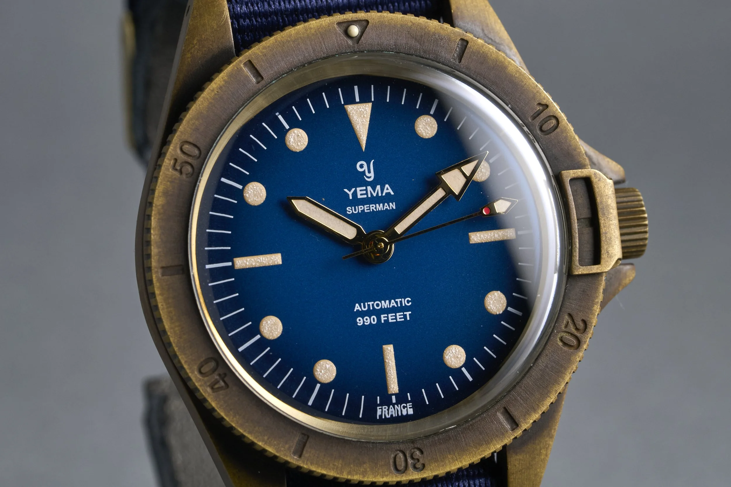 yema-superman.bronze.boxpapers-ysupz-blue.dial-2010-oysterpalace-OP2327-04.jpg