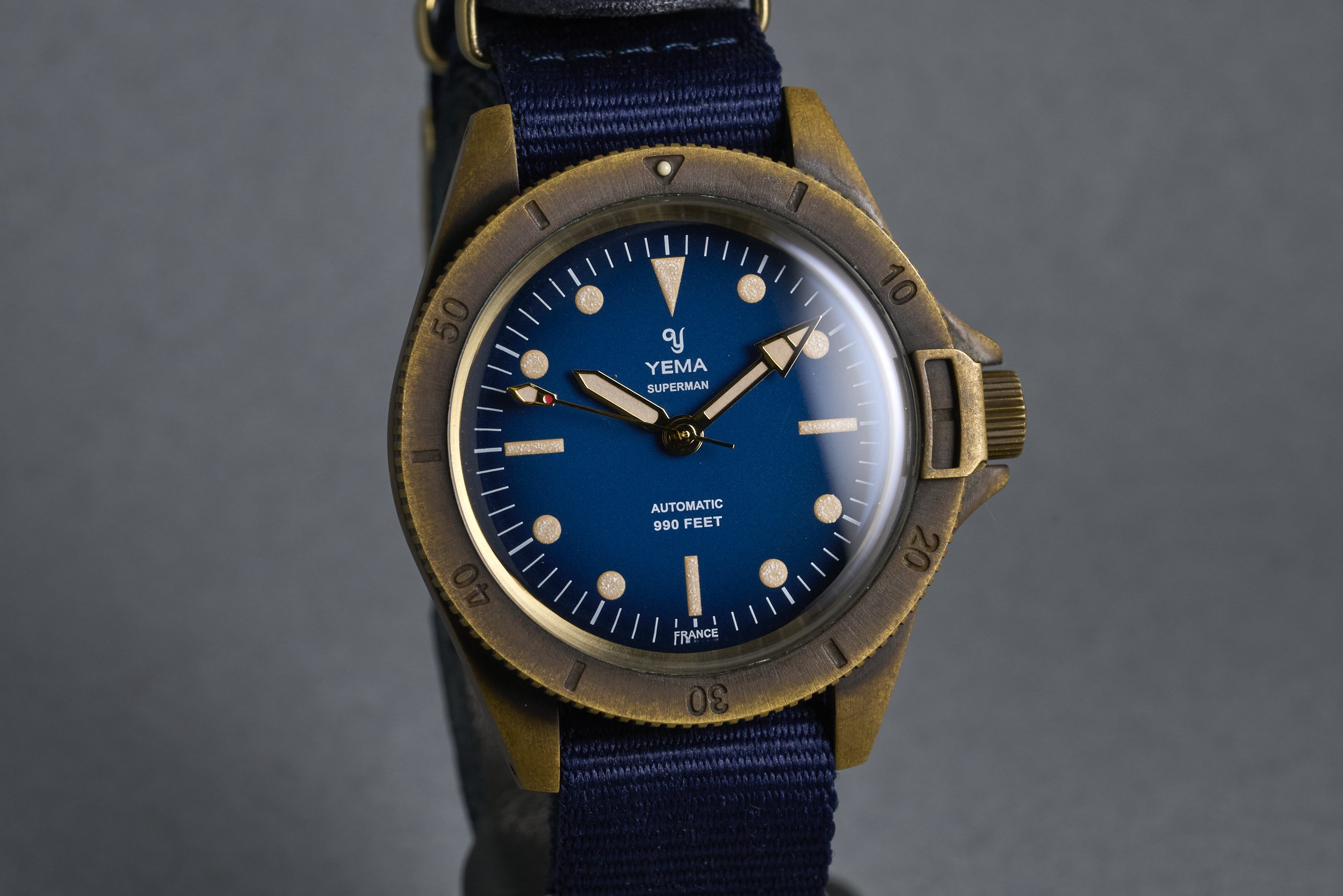 yema-superman.bronze.boxpapers-ysupz-blue.dial-2010-oysterpalace-OP2327-02.jpg