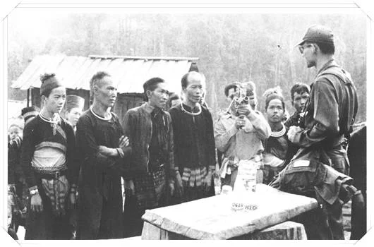 His Majesty (right) introducing arabica coffee to a hill tribe, c.a. 1971.