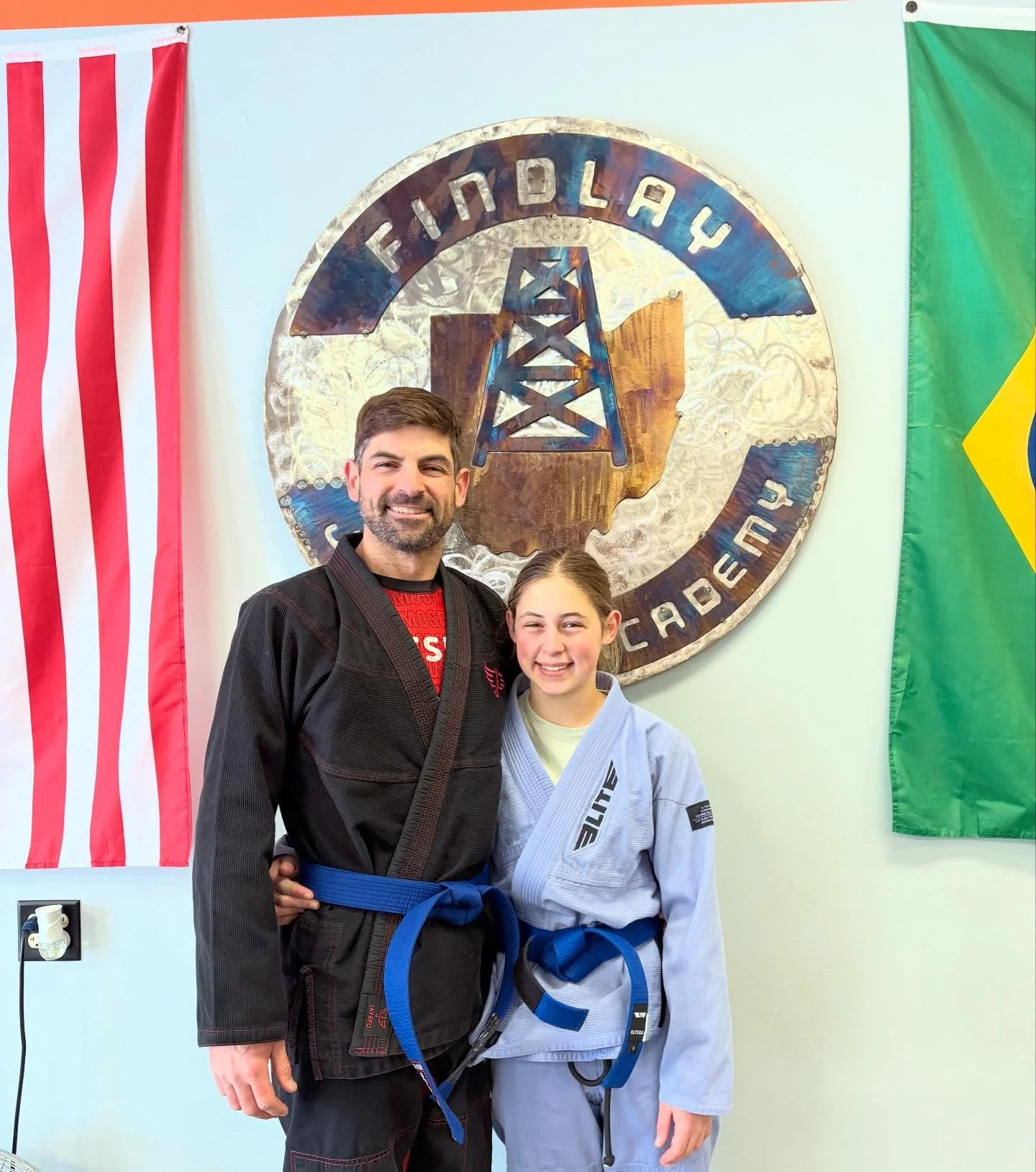We have two new blue belts at FJJA! Jake and his daughter Cora (along with the rest of the family) have been with us for almost four years. Jake has had to take some time off over the years, but anyone who has ever trained with him knows he is more t