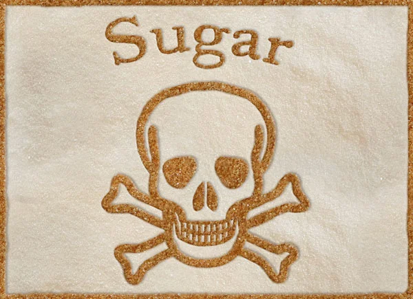 a skull and crossbones made of white and brown sugar copyright Tracy Tredoux Nutritional Therapy 2019