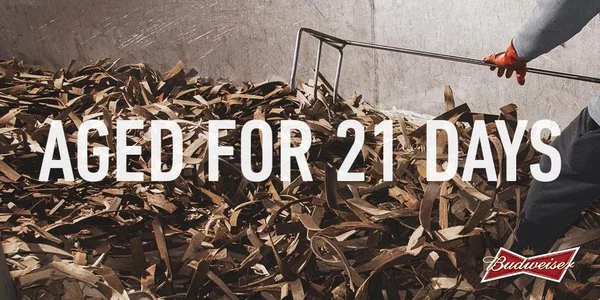 Here Budweiser promotes the fact that its aged 75% as long as traditional pilsners.