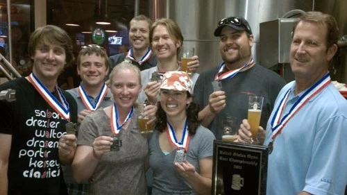 The only photo I could find of Gary Fish (far right) with medals--though not the GABF. Source: Deschutes Brewery