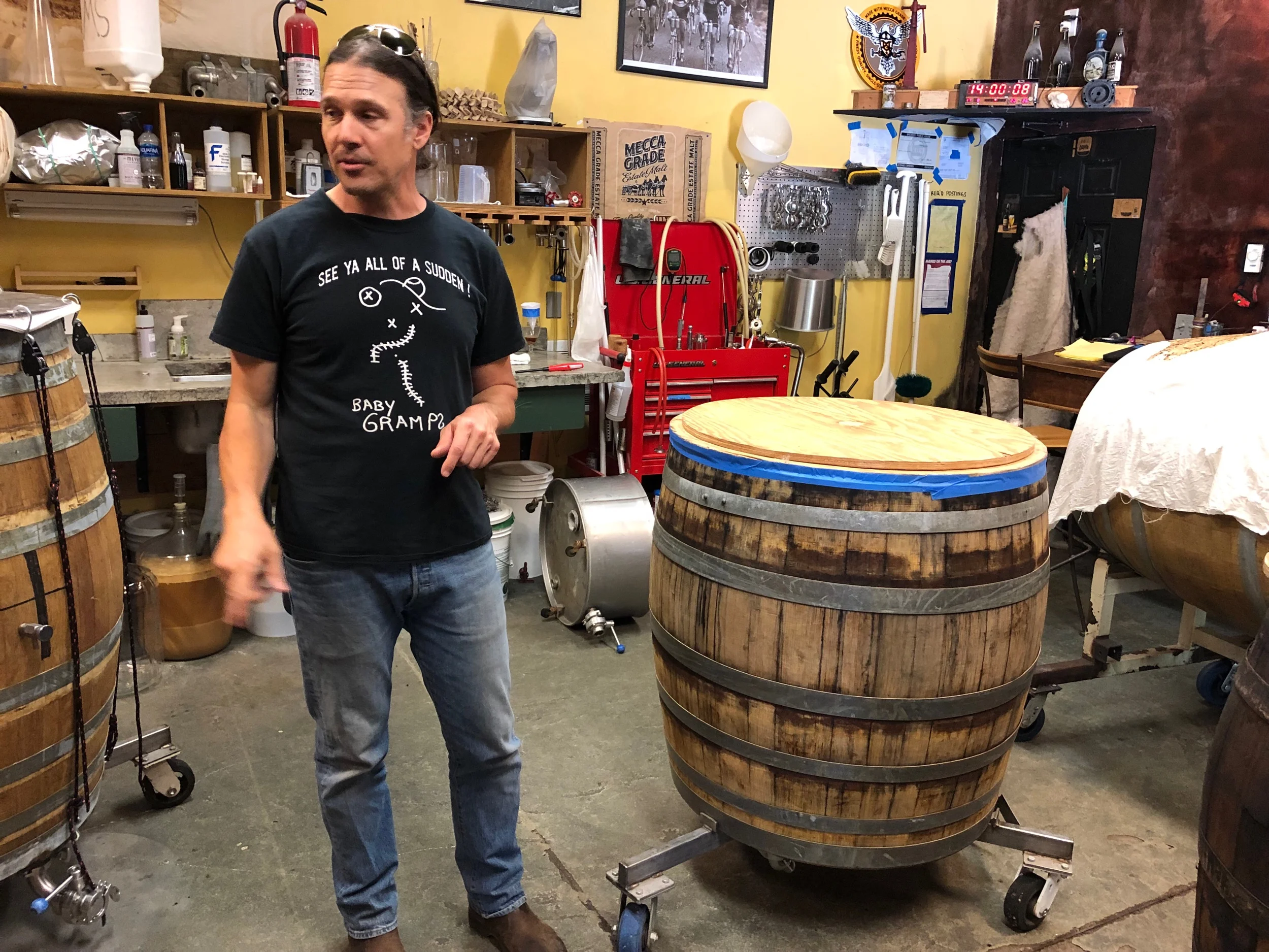 Paul Arney in his brewery. He’s standing next to his mash tun.
