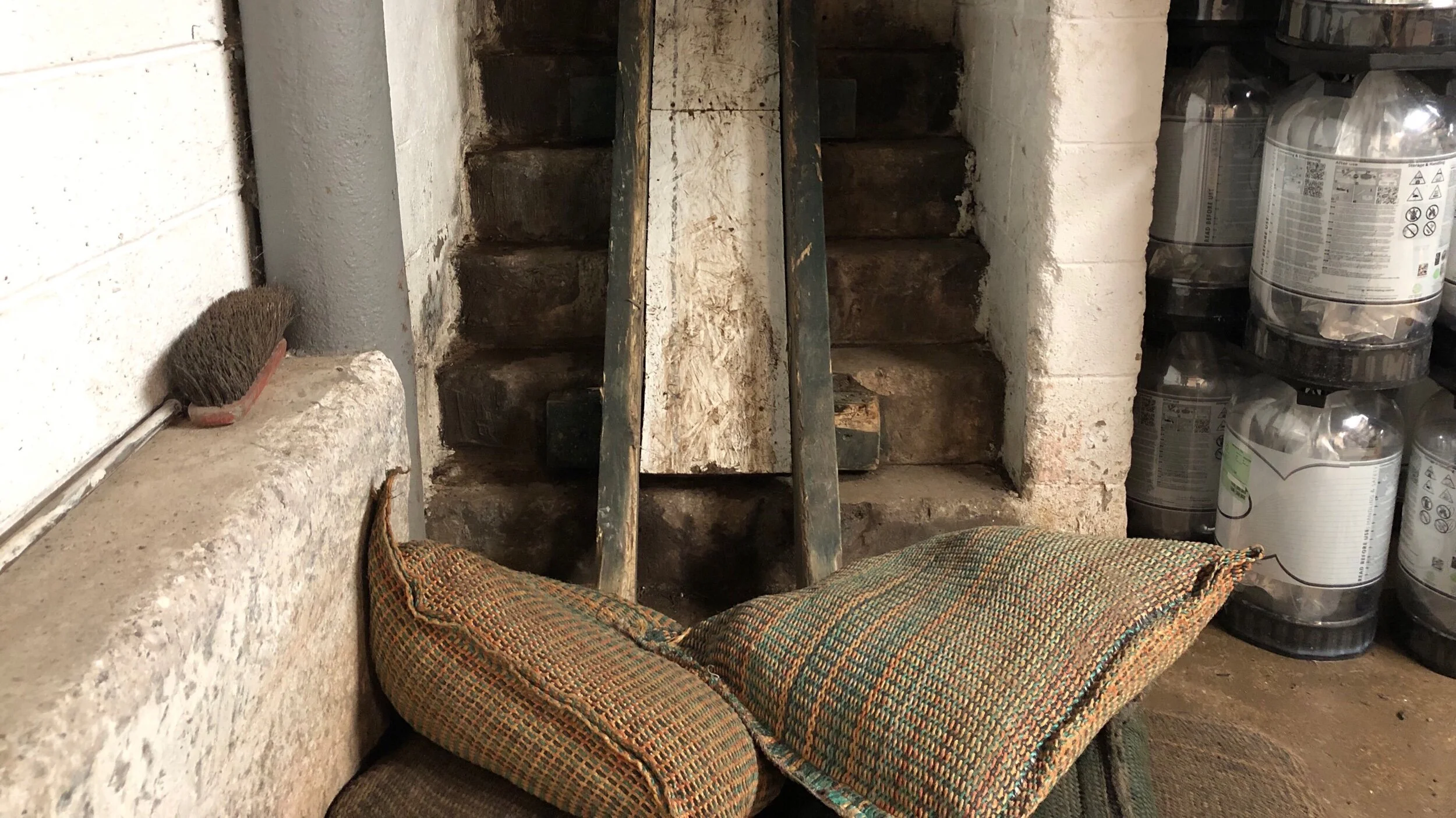 The chute to the cellar, down which casks probably quite literally shoot (and land with a thud).