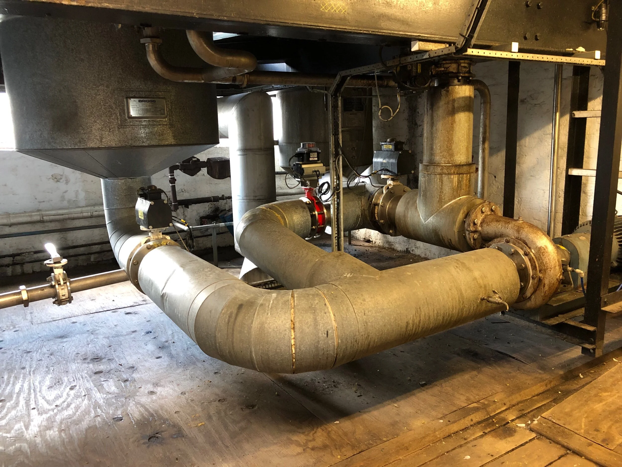 Pipes under the kettle.