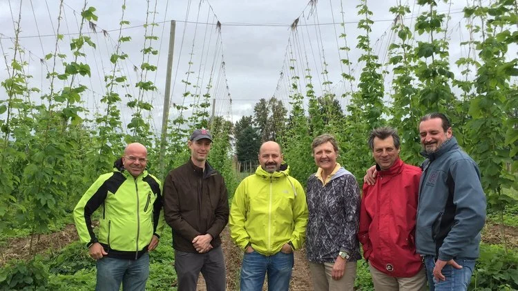 Agostino Arioli (center) at Gayle Goschie’s hop farm a few years ago (that’s Gayle next to him).