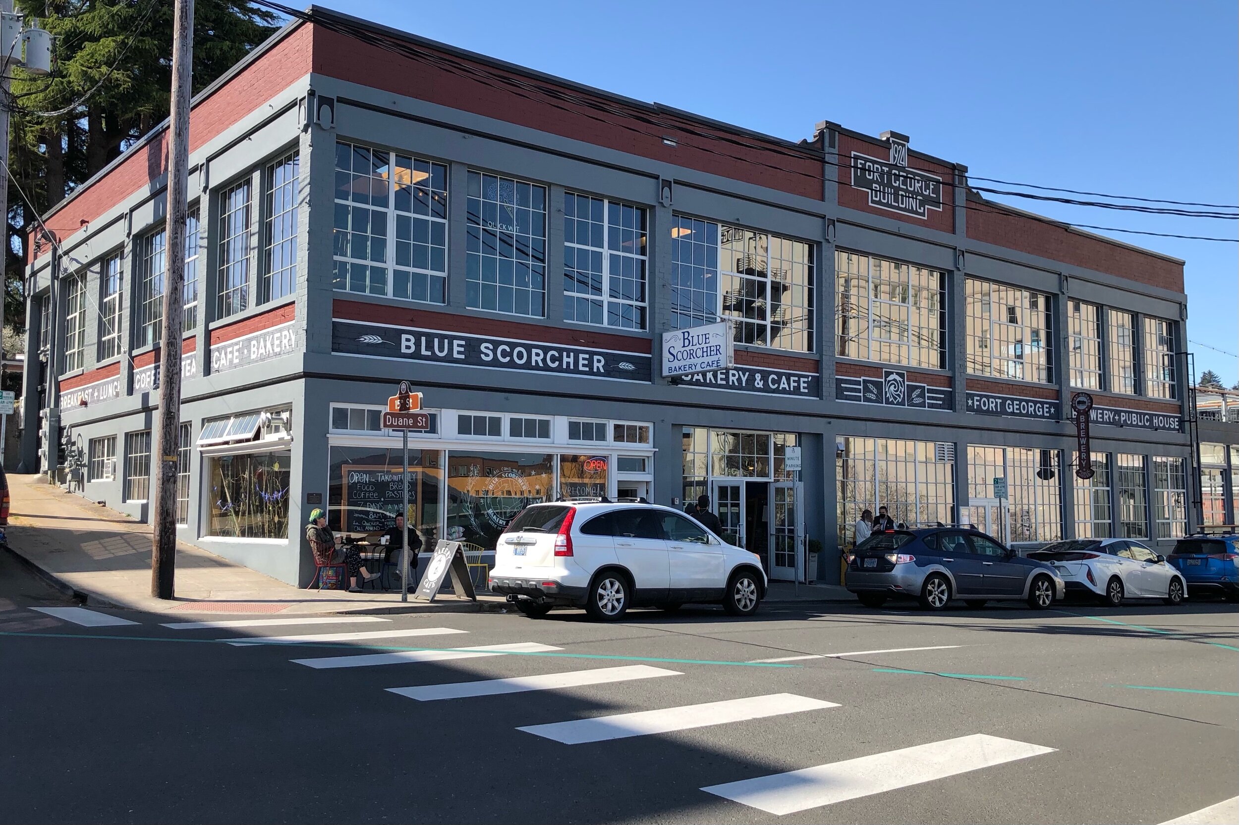 The original building, with the pizza pub on top, the original pub lower right, and the Blue Scorcher in its original, honored place.