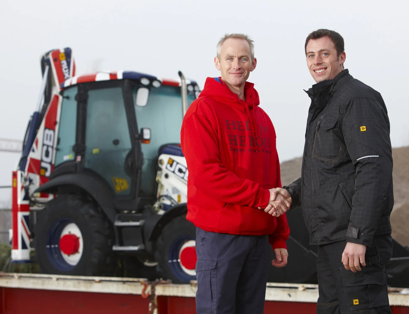  Help for Heroes receive a JCB digger donated by the company to be auctioned off to raise funds for the charity. Digger arrives at Tilbury docks, Essex RM18 on 6th December 2010 