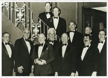 The original ten members with Bob Hope after performing at a dinner in honor of Princess Grace of Monaco in 1981. Back row: Wayne Barber, Rich McGlynn, Joe Caron, Bill Soons, Ward Dorer. Front row: Roger Englander, Don Selby, Mr. Hope, Bill Moore, John Dorer, Gordon McLaren.