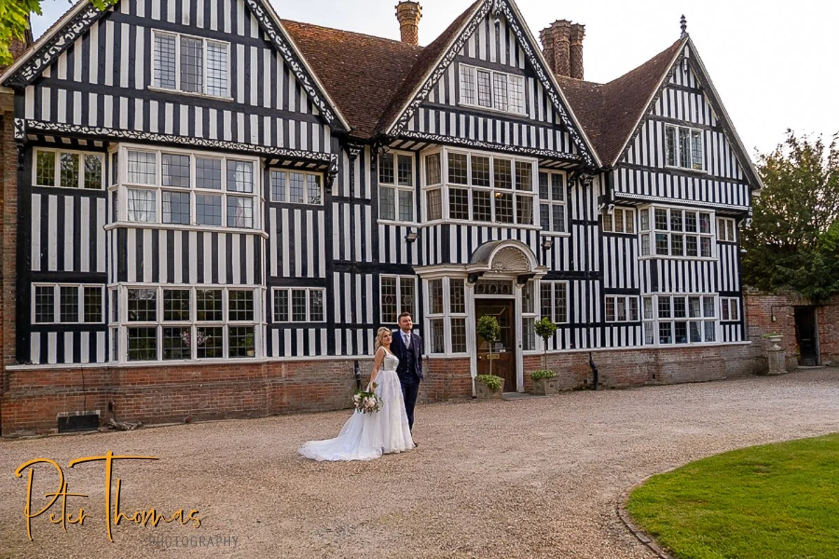 The newly married couple standing outside Brickwall house wedding venue