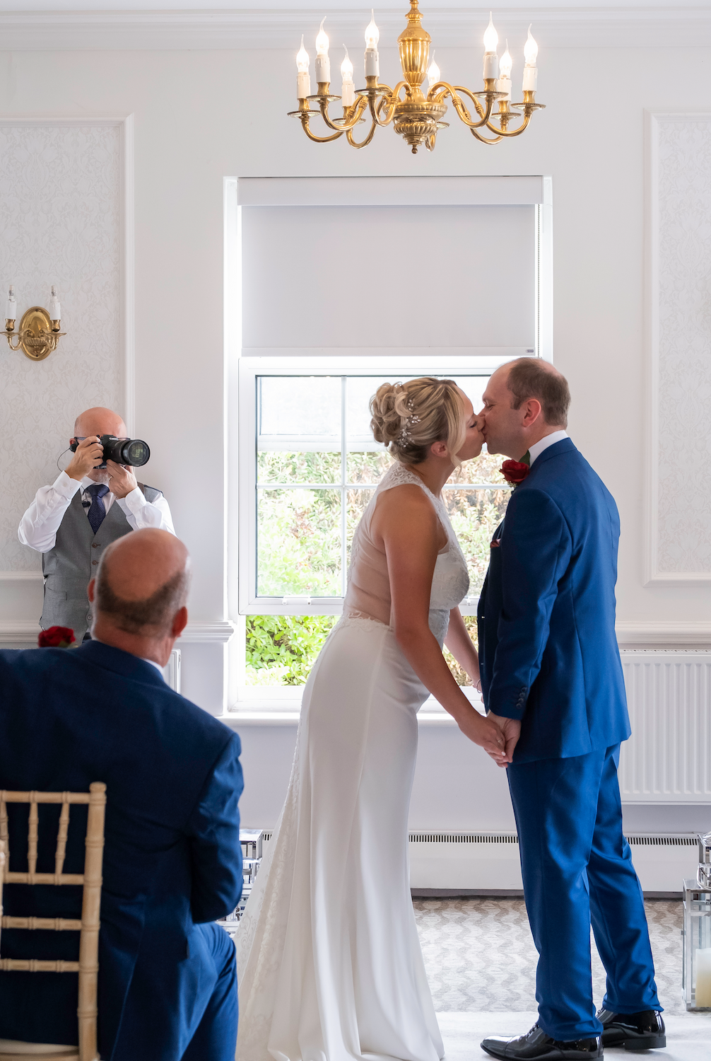 Peter capturing the bride and grooms 1st kiss