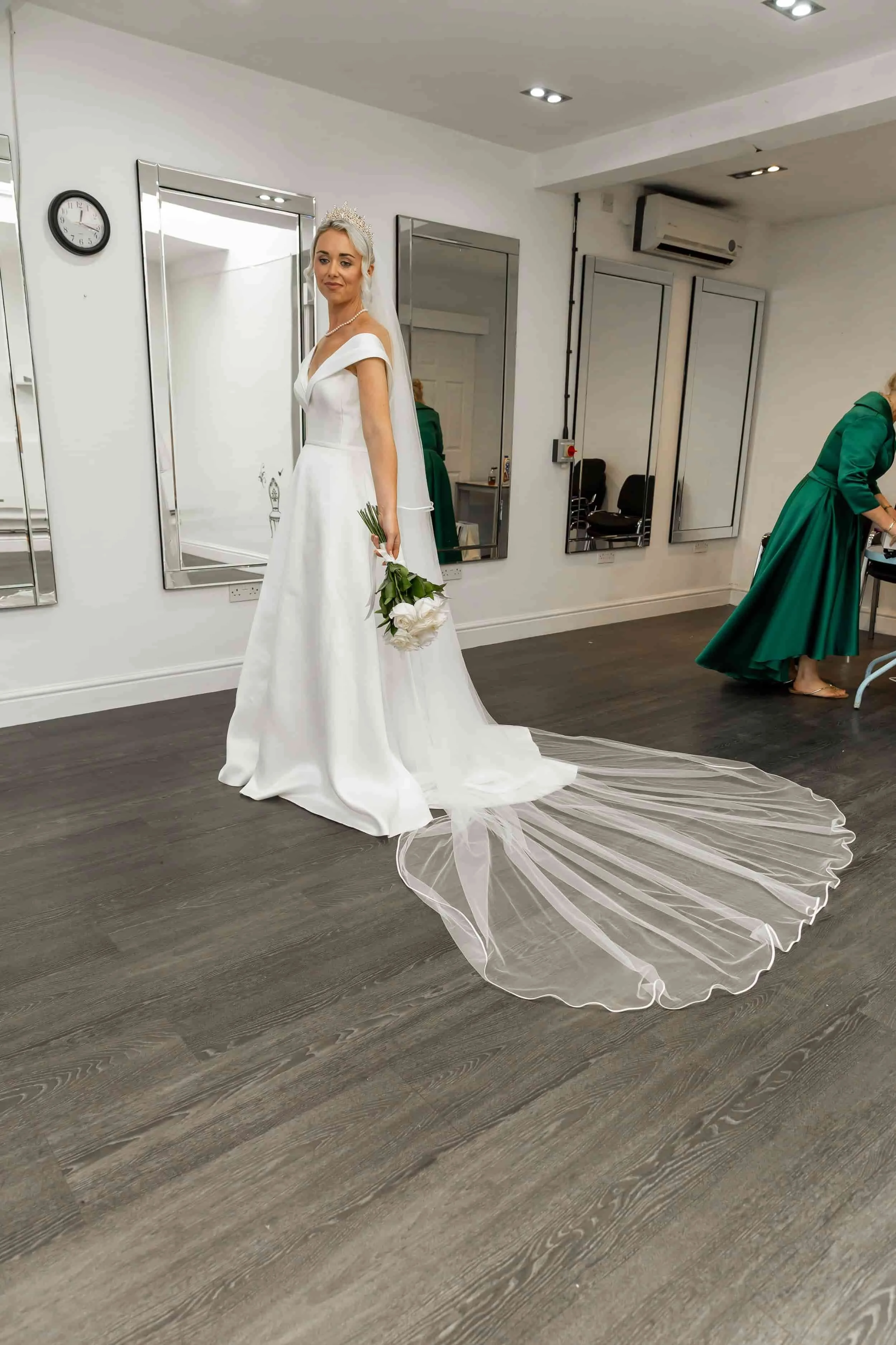 Bride in her dress in a clear area ready for photography