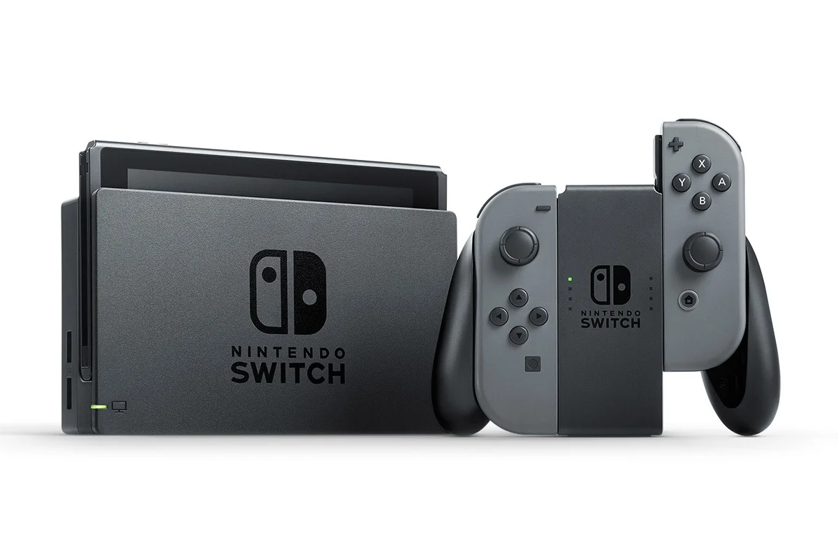 The Nintendo Switch console, dock and Joy-Con controllers in the grip.