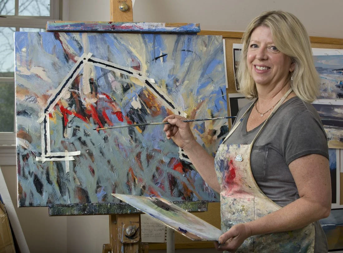 Artist Sally Veach paints her latest barn painting titled "The Burning 2" inside her home studio in Woodstock. Veach uses her abstract expressionism style in this oil and acrylic medium. She is showing her art work at the Barns of Rose Hill in Berryville. Rich Cooley/Daily