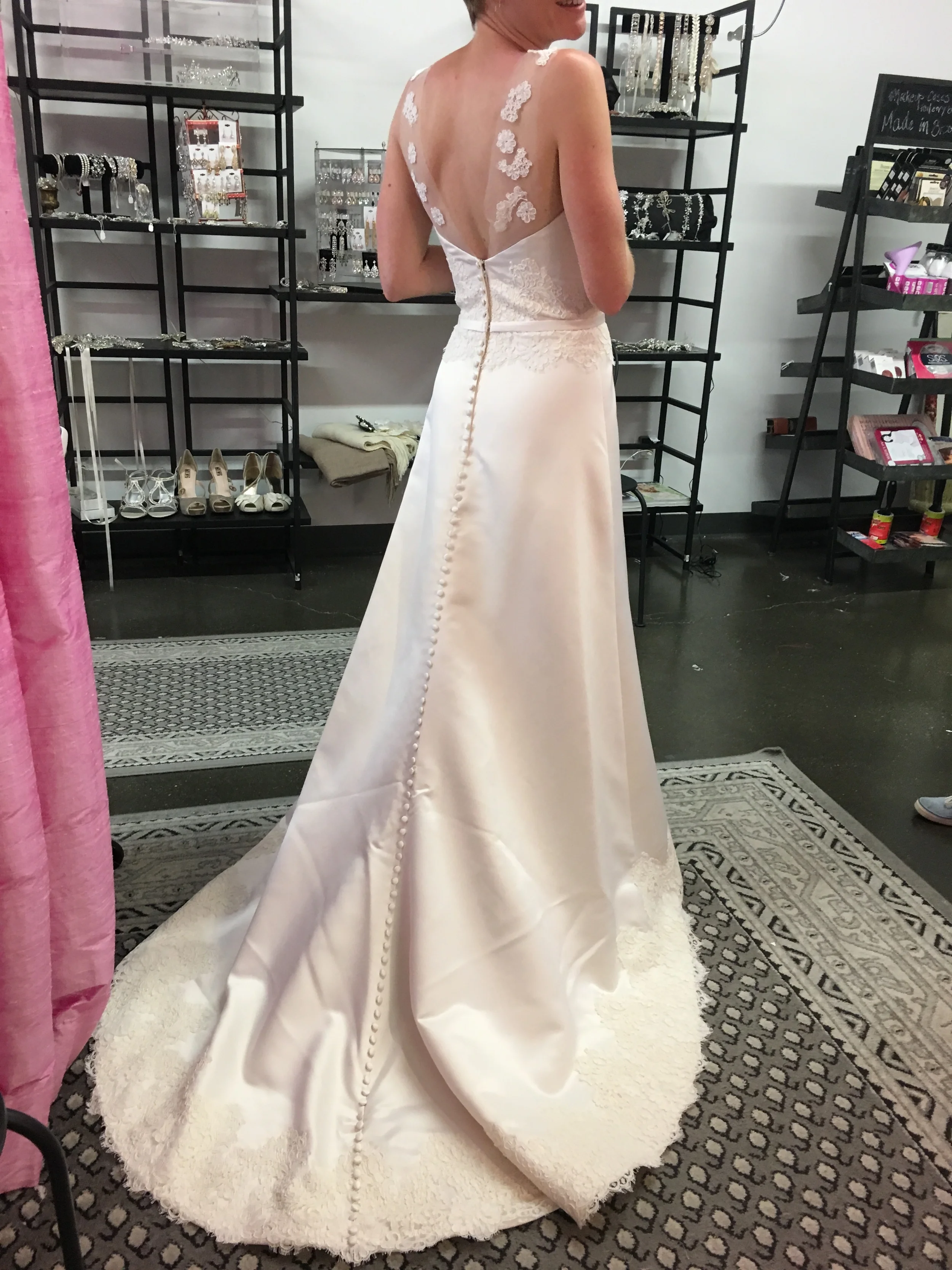Bride adding a build-up neckline to her wedding dress