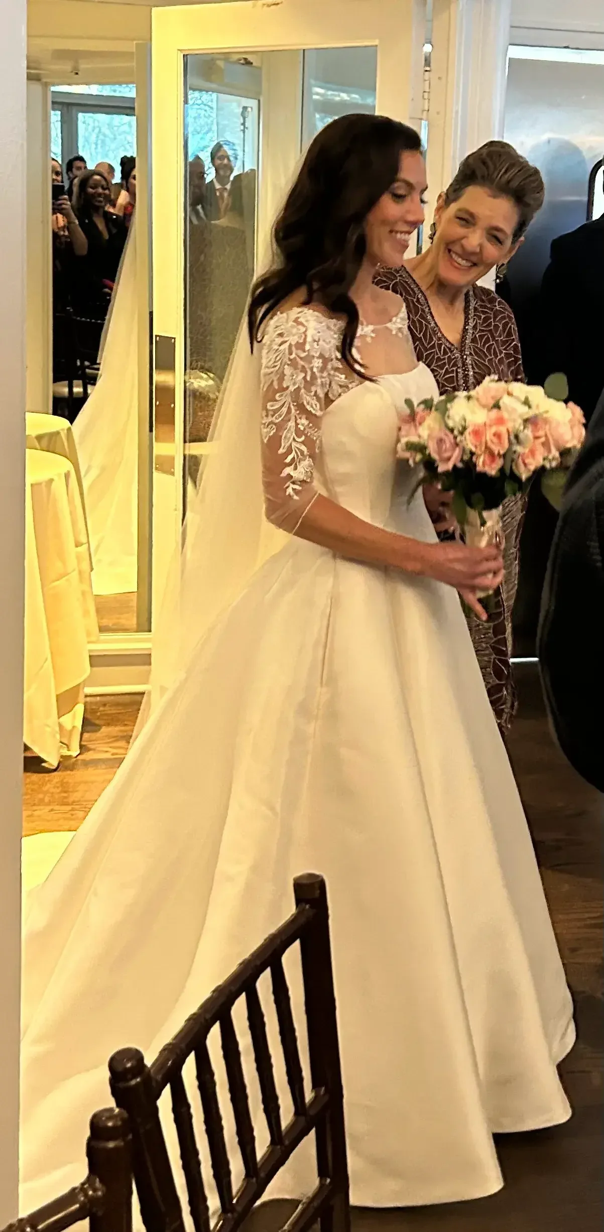 Bride wearing the bridal gown altered at the Wedding Dresser