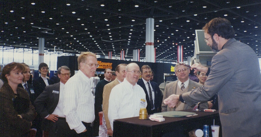 Hondo draws a crowd on behalf of exhibitor Snyder General at the ASHRAE Show in Chicago's McCormick Place. Magic helps "shorten the day" during long exhibit hours, and takes minds off of tired legs.